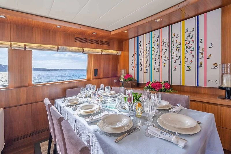 a dining table set for a dinner aboard LEX Yacht for Sale