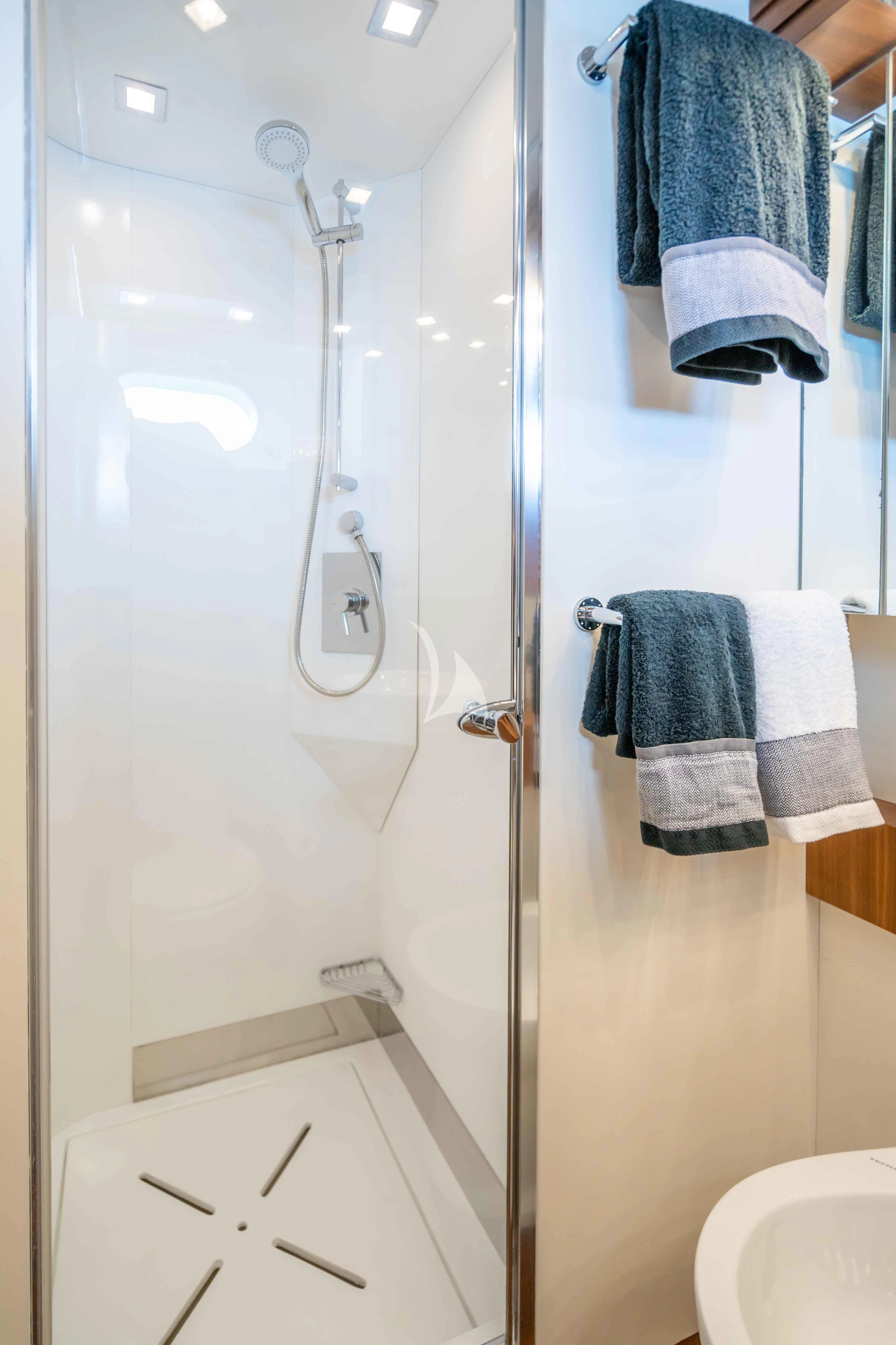 a bathroom with a shower and a sink aboard LEX Yacht for Sale