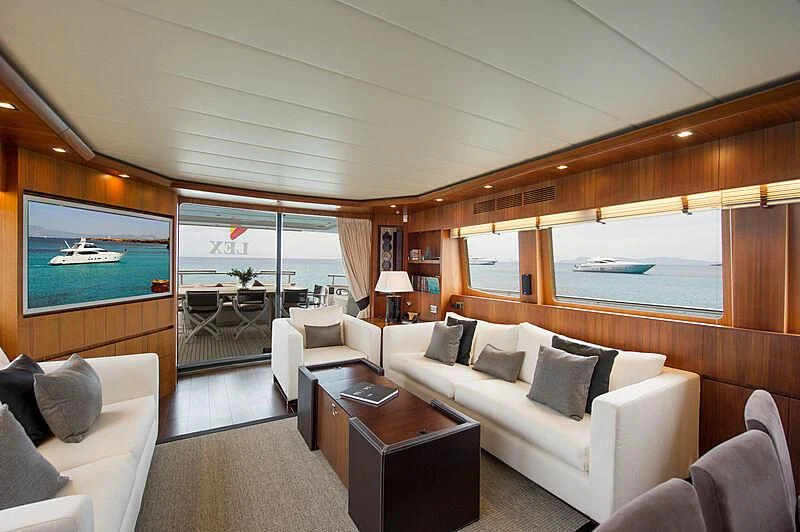 a living room with a large window aboard LEX Yacht for Sale