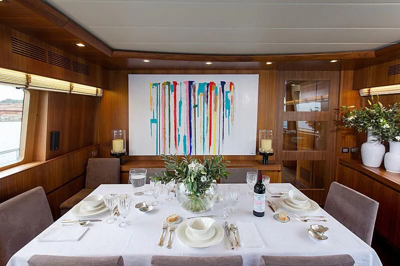 a table set for a dinner aboard LEX Yacht for Sale