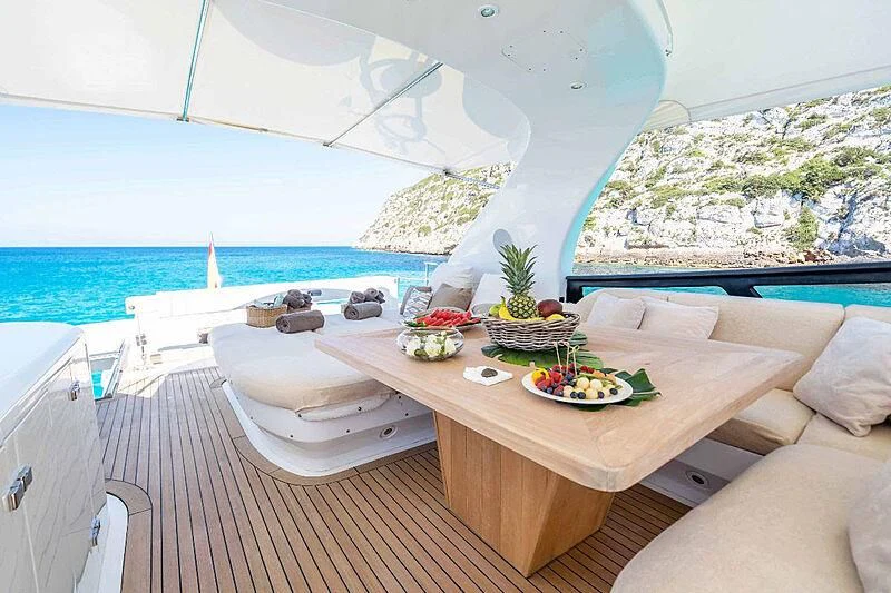 a table with food on it aboard LEX Yacht for Sale