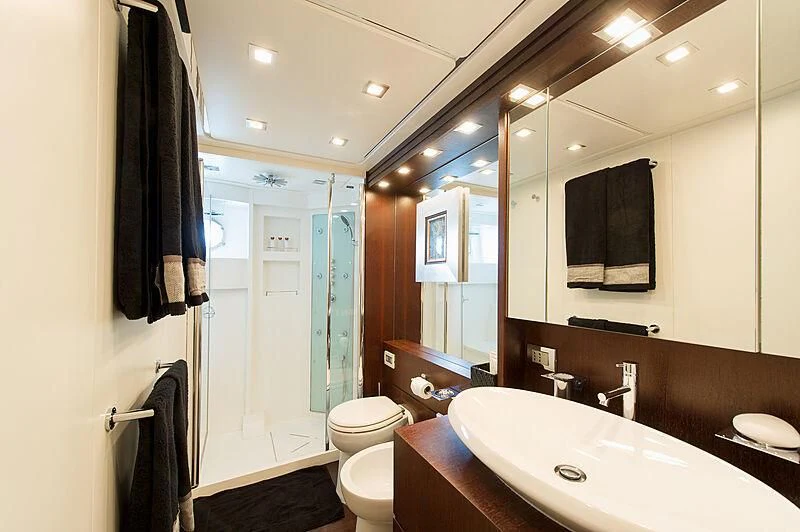 a bathroom with a sink and a toilet aboard LEX Yacht for Sale