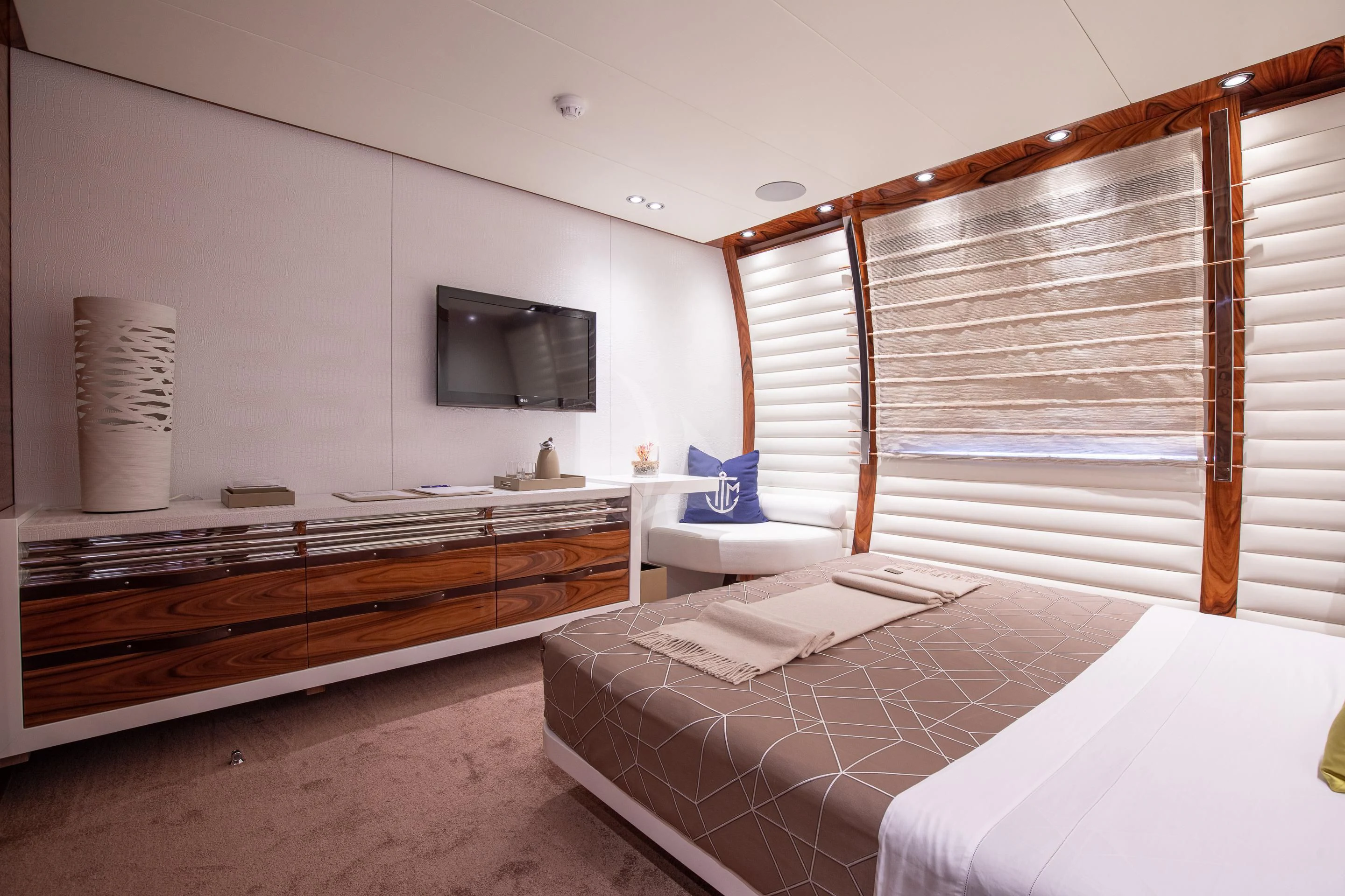 a room with a bed and a television aboard HATT MILL Yacht for Sale