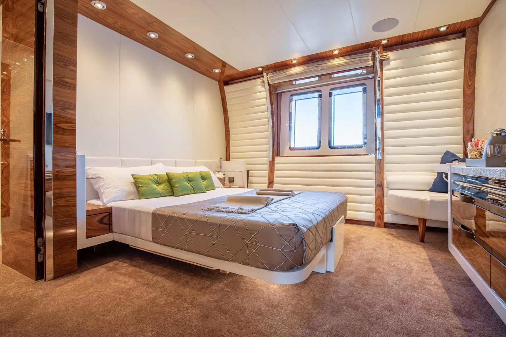 a bedroom with a bed and a desk aboard HATT MILL Yacht for Sale