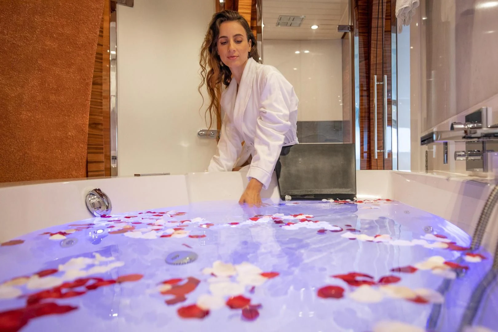 a woman standing next to a table covered in paints aboard HATT MILL Yacht for Sale