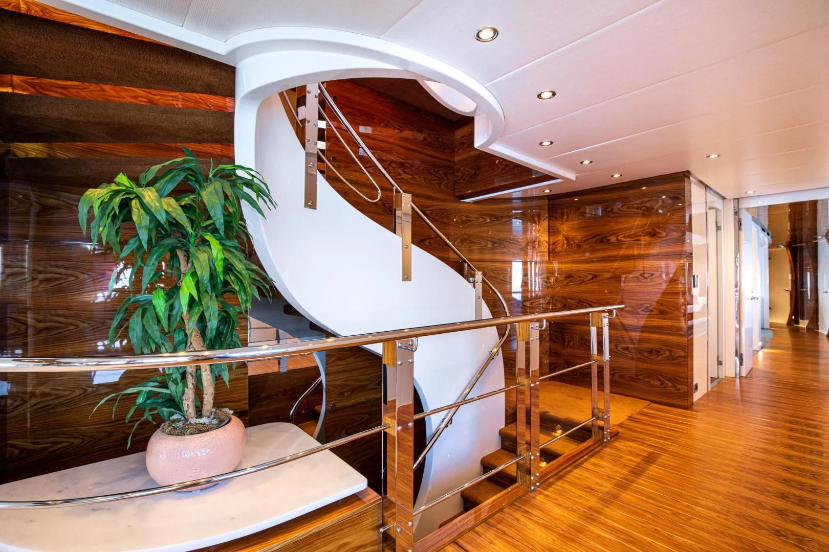 a plant in a pot on a staircase aboard HATT MILL Yacht for Sale