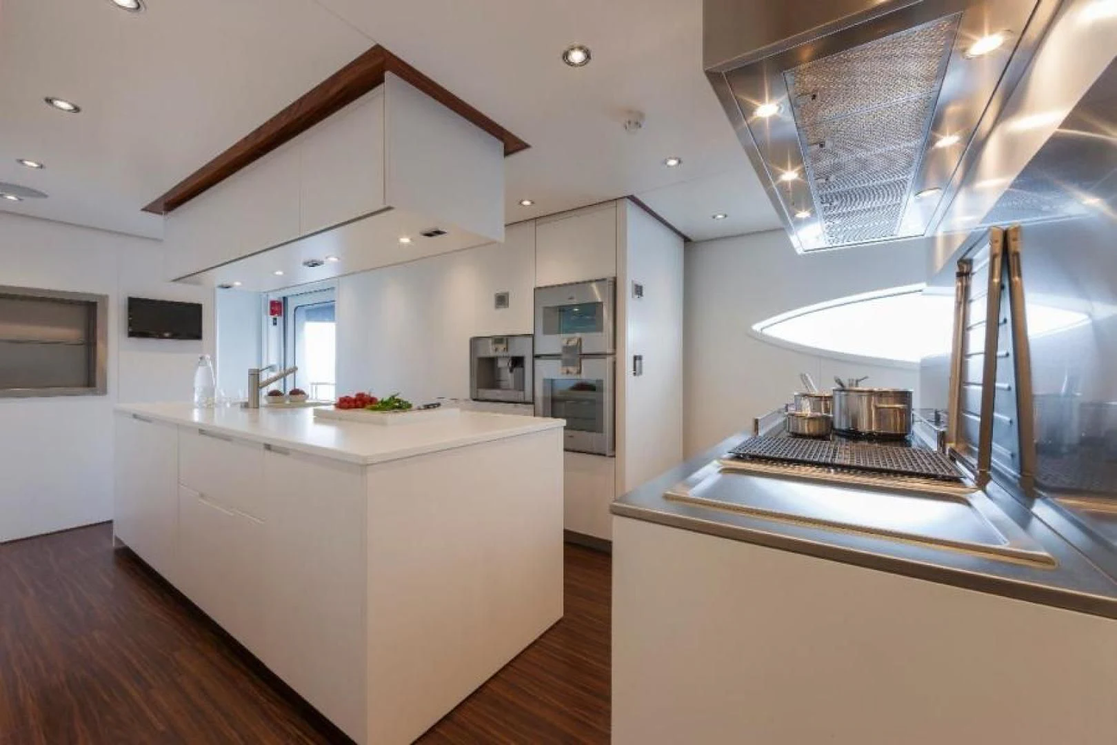 a kitchen with a large island aboard HATT MILL Yacht for Sale