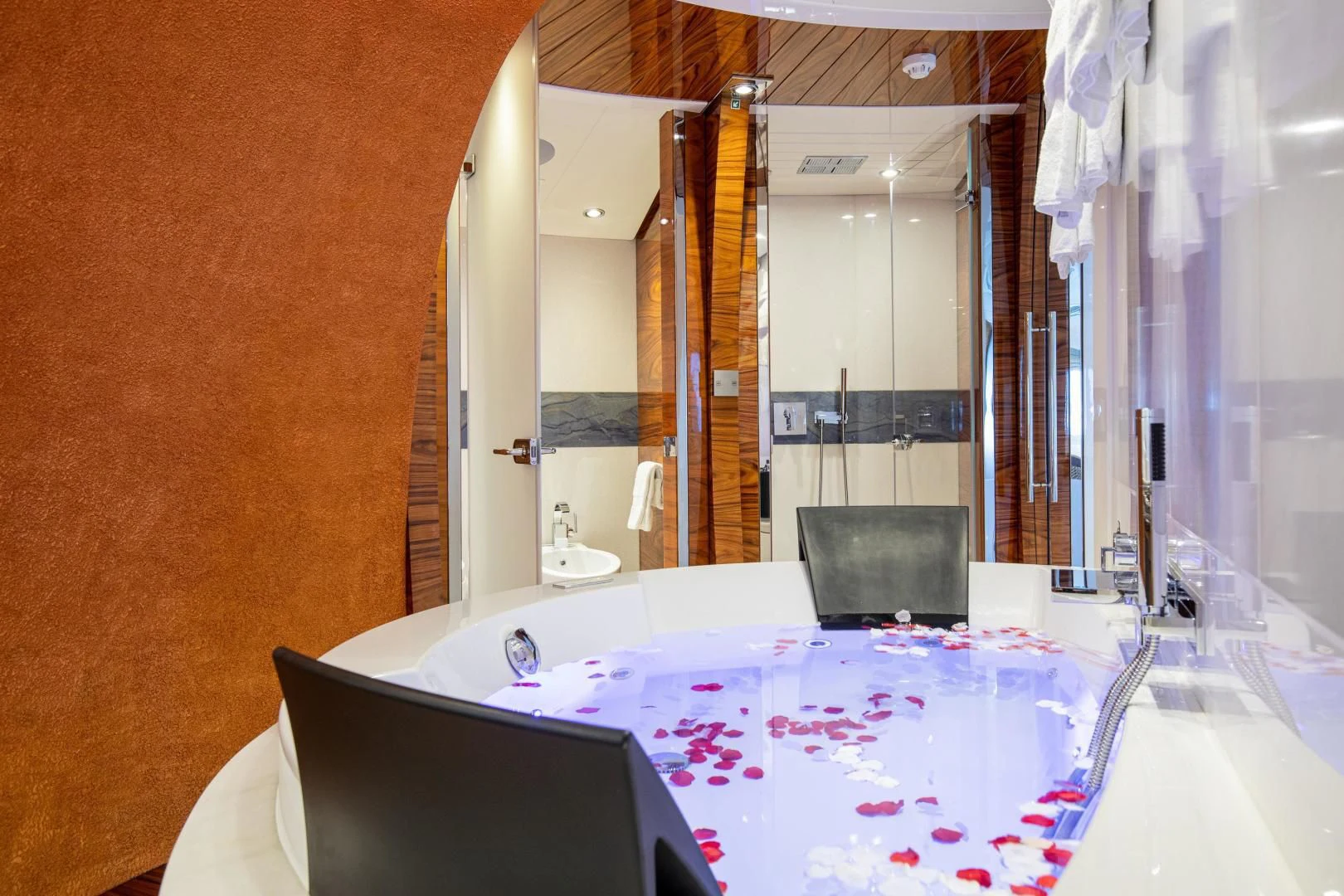 a table with a mirror and a large white tablecloth with pink flowers aboard HATT MILL Yacht for Sale