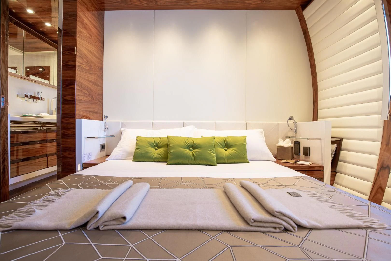 a bed with a white bed spread aboard HATT MILL Yacht for Sale