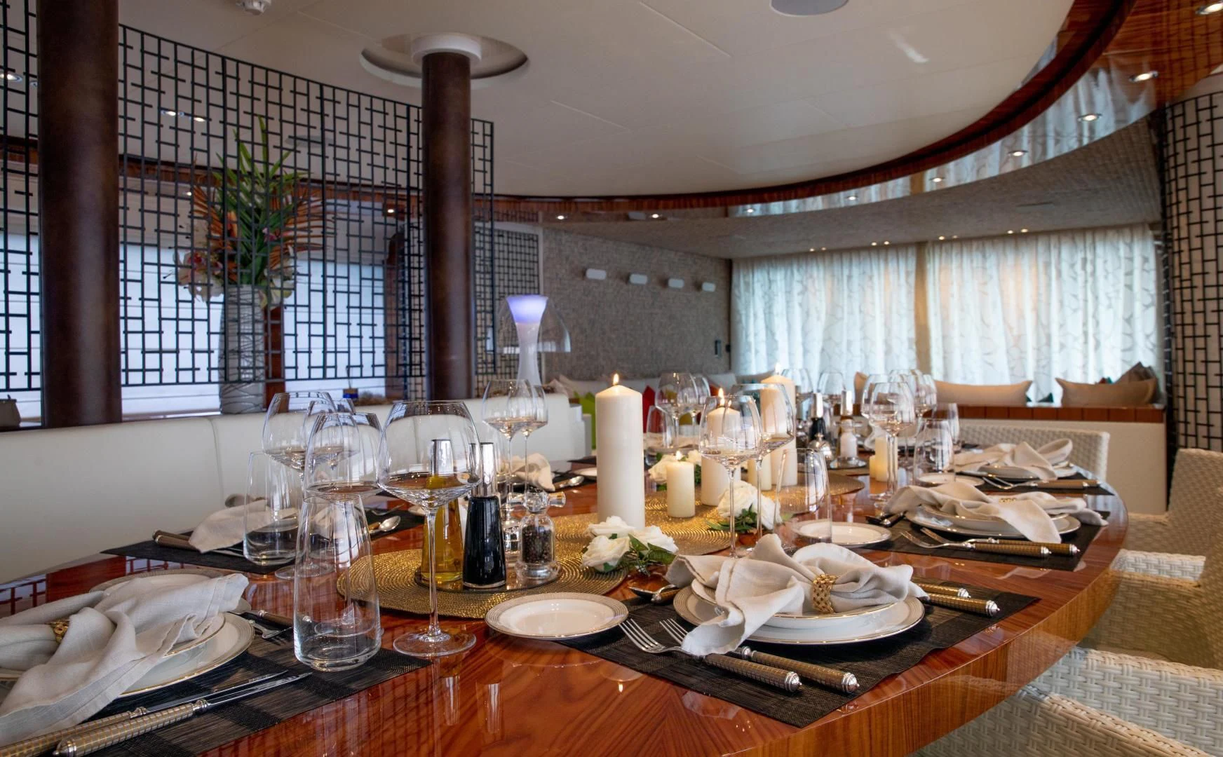 a table with plates and glasses aboard HATT MILL Yacht for Sale