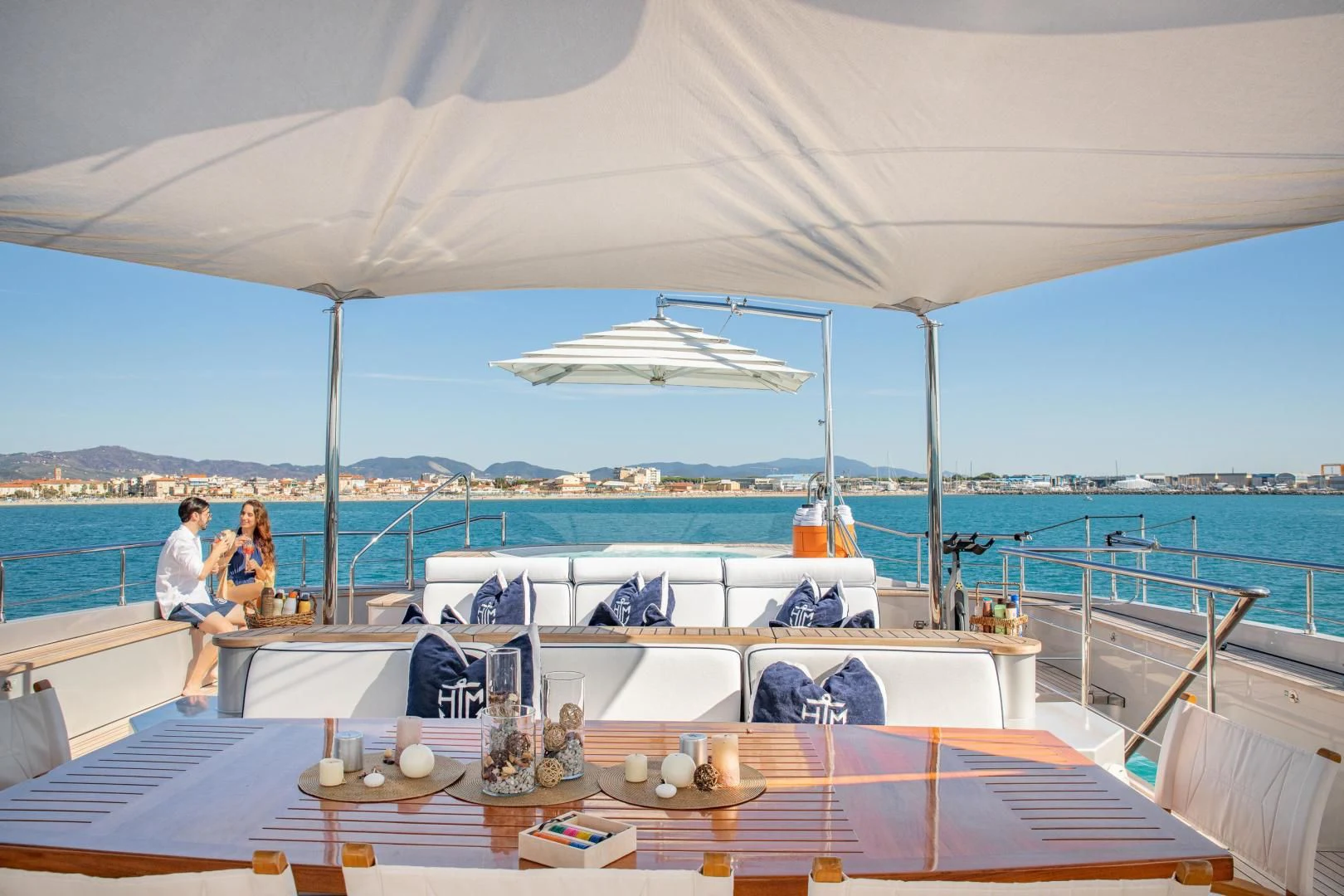 a couple sitting on a boat aboard HATT MILL Yacht for Sale