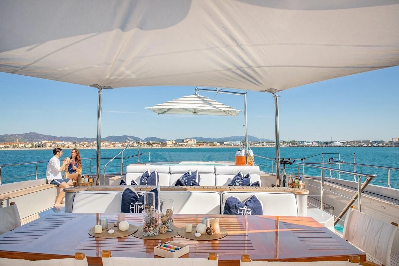 a couple sitting on a boat aboard HATT MILL Yacht for Sale