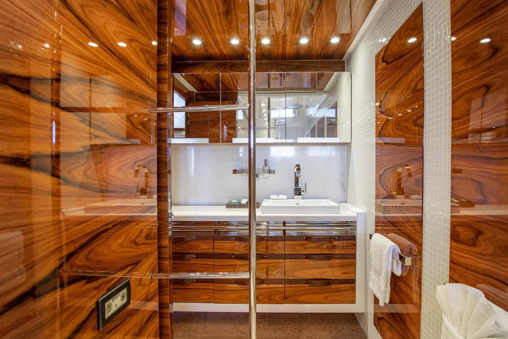 a bathroom with a large wooden wall aboard HATT MILL Yacht for Sale