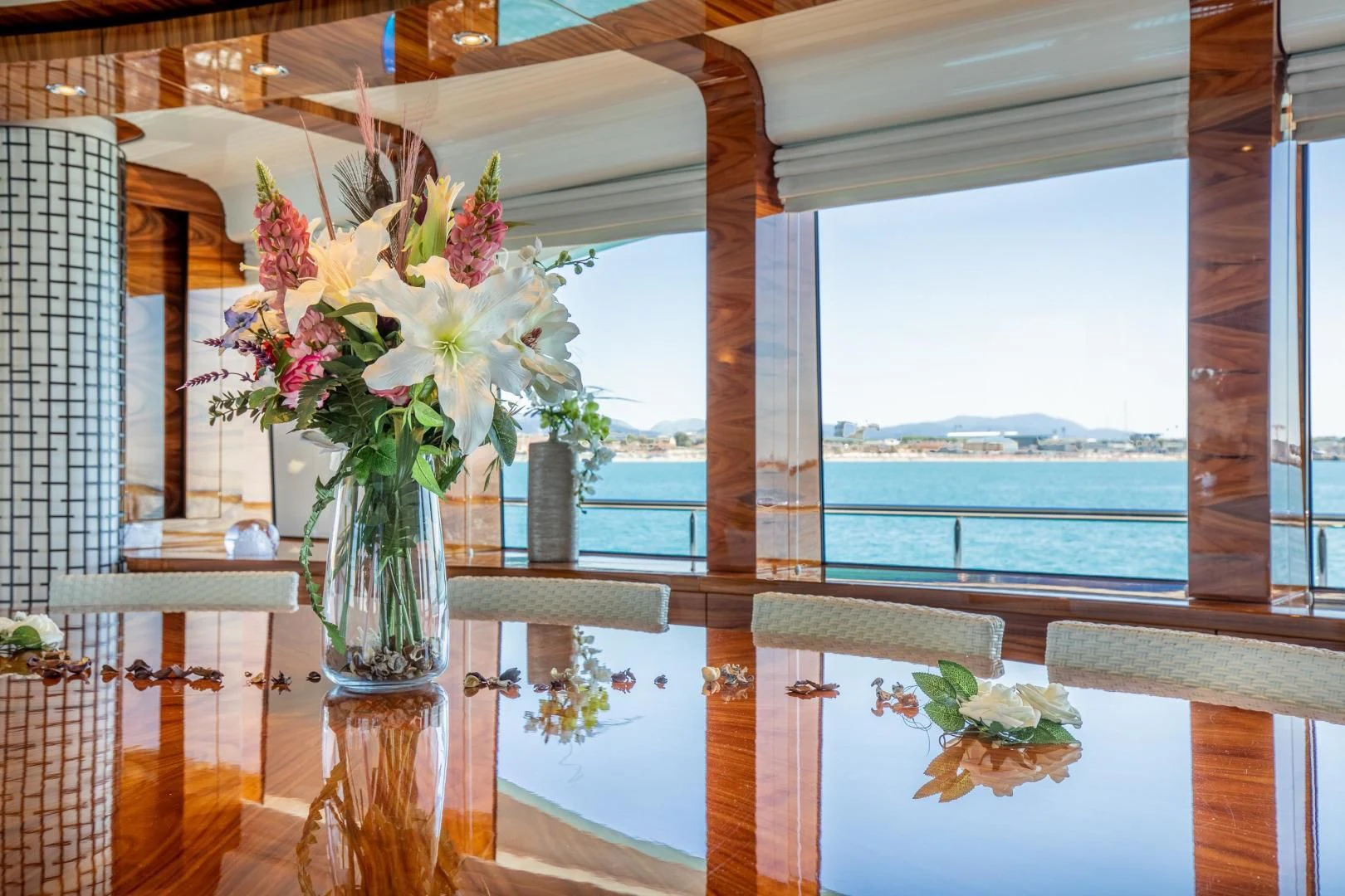 a vase with flowers on a window sill aboard HATT MILL Yacht for Sale