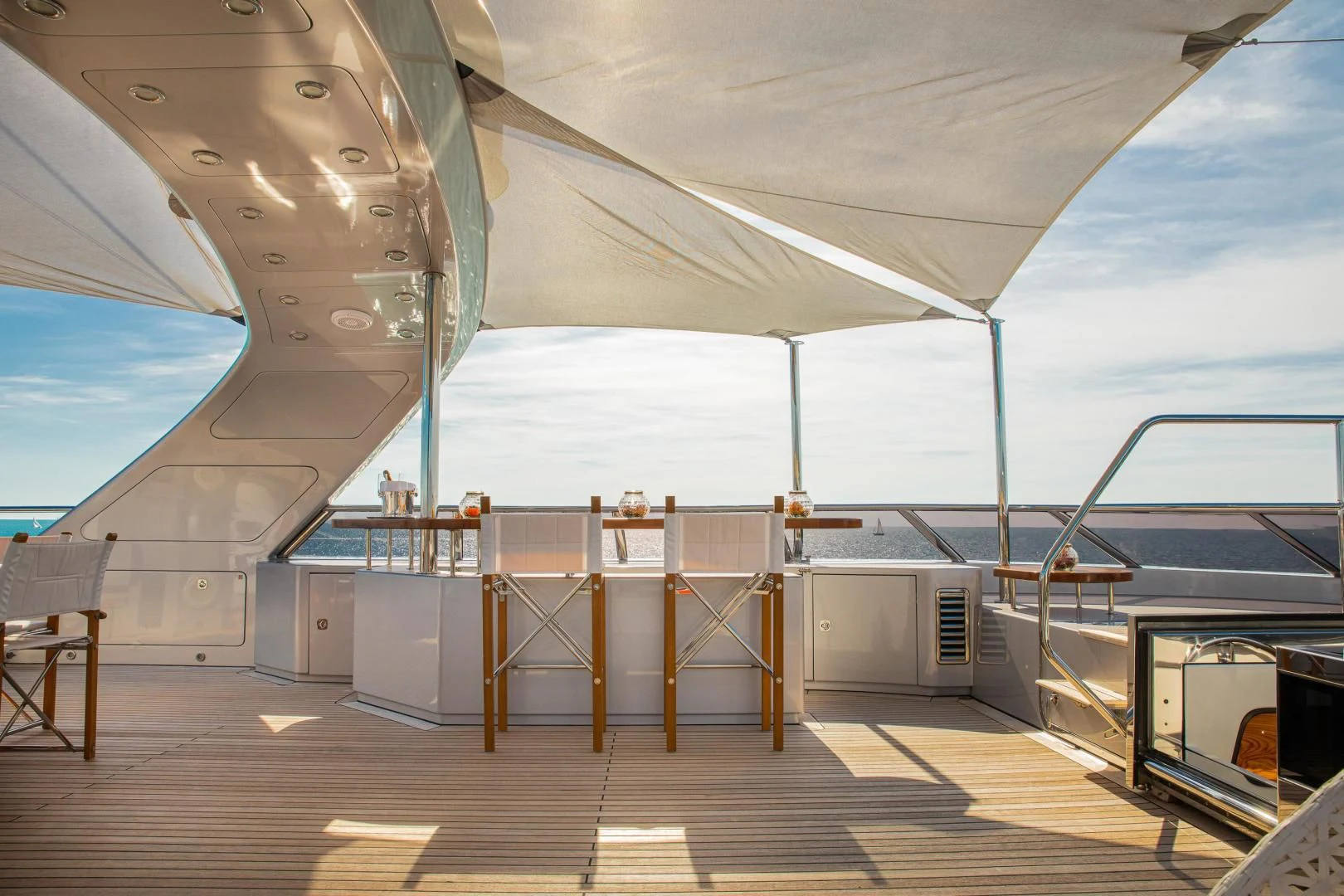 a large room with a deck and a large boat aboard HATT MILL Yacht for Sale