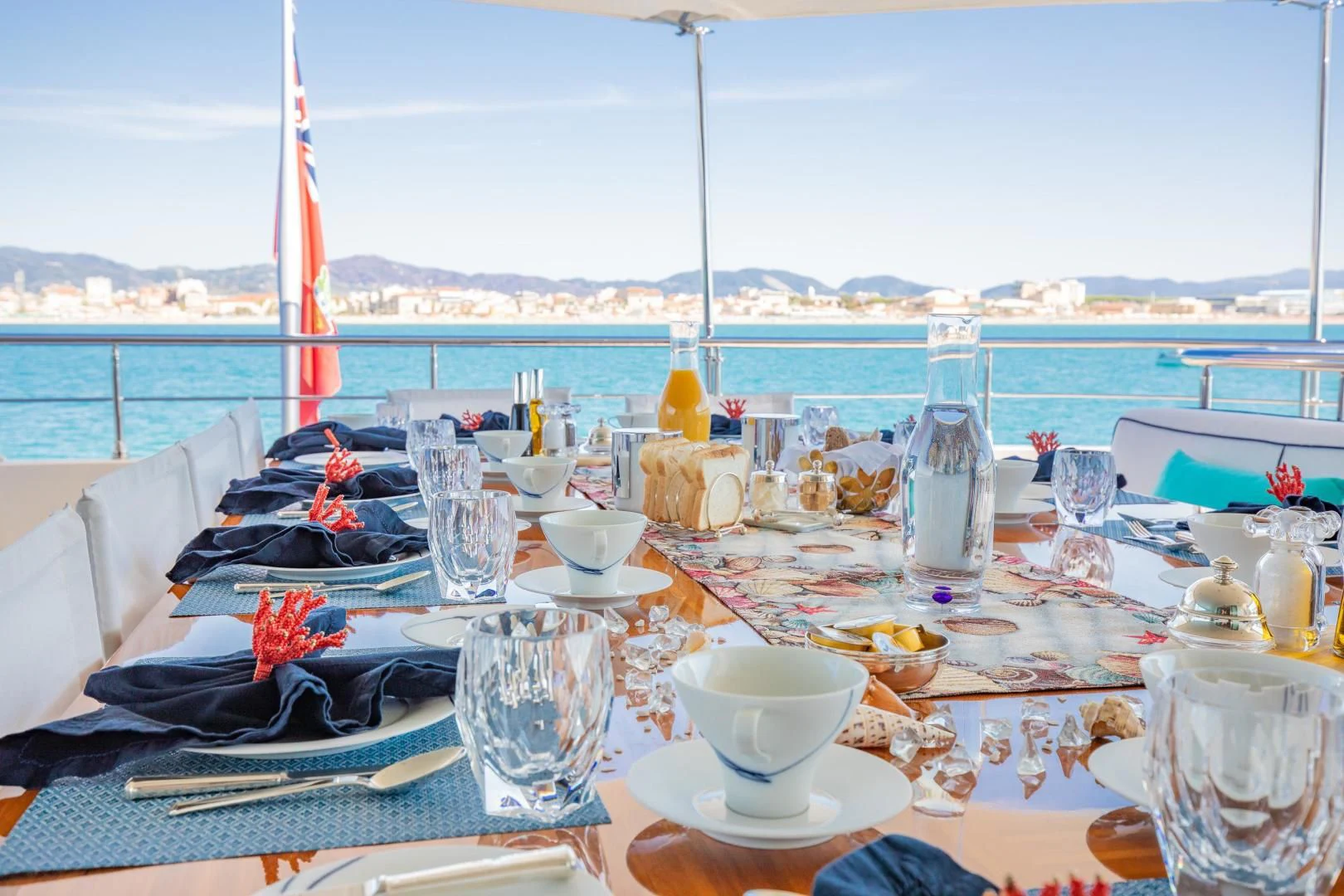 a table with food and drinks on it aboard HATT MILL Yacht for Sale