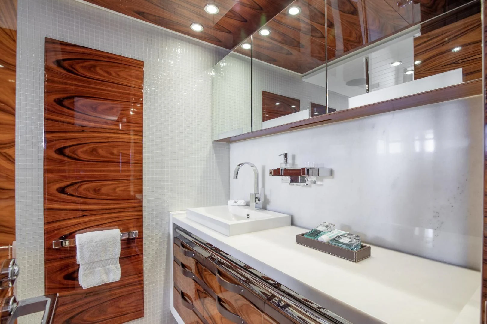 a bathroom with a sink and a mirror aboard HATT MILL Yacht for Sale