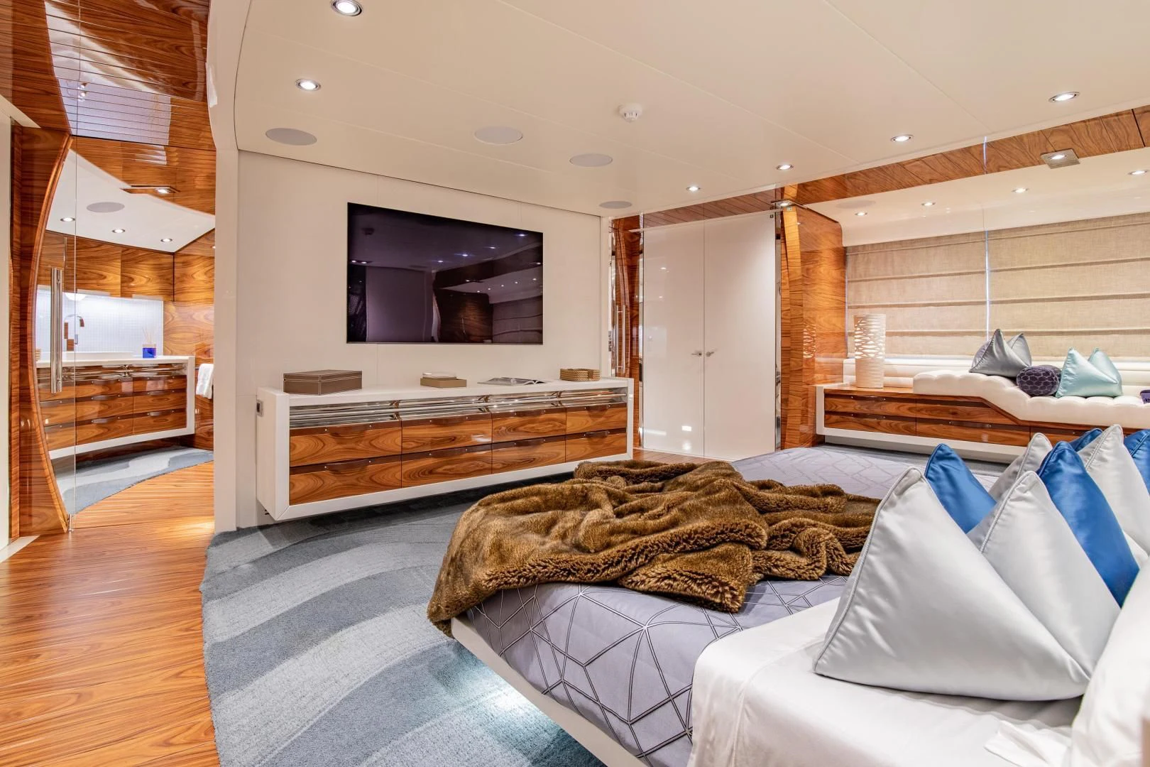 a bedroom with a large tv aboard HATT MILL Yacht for Sale