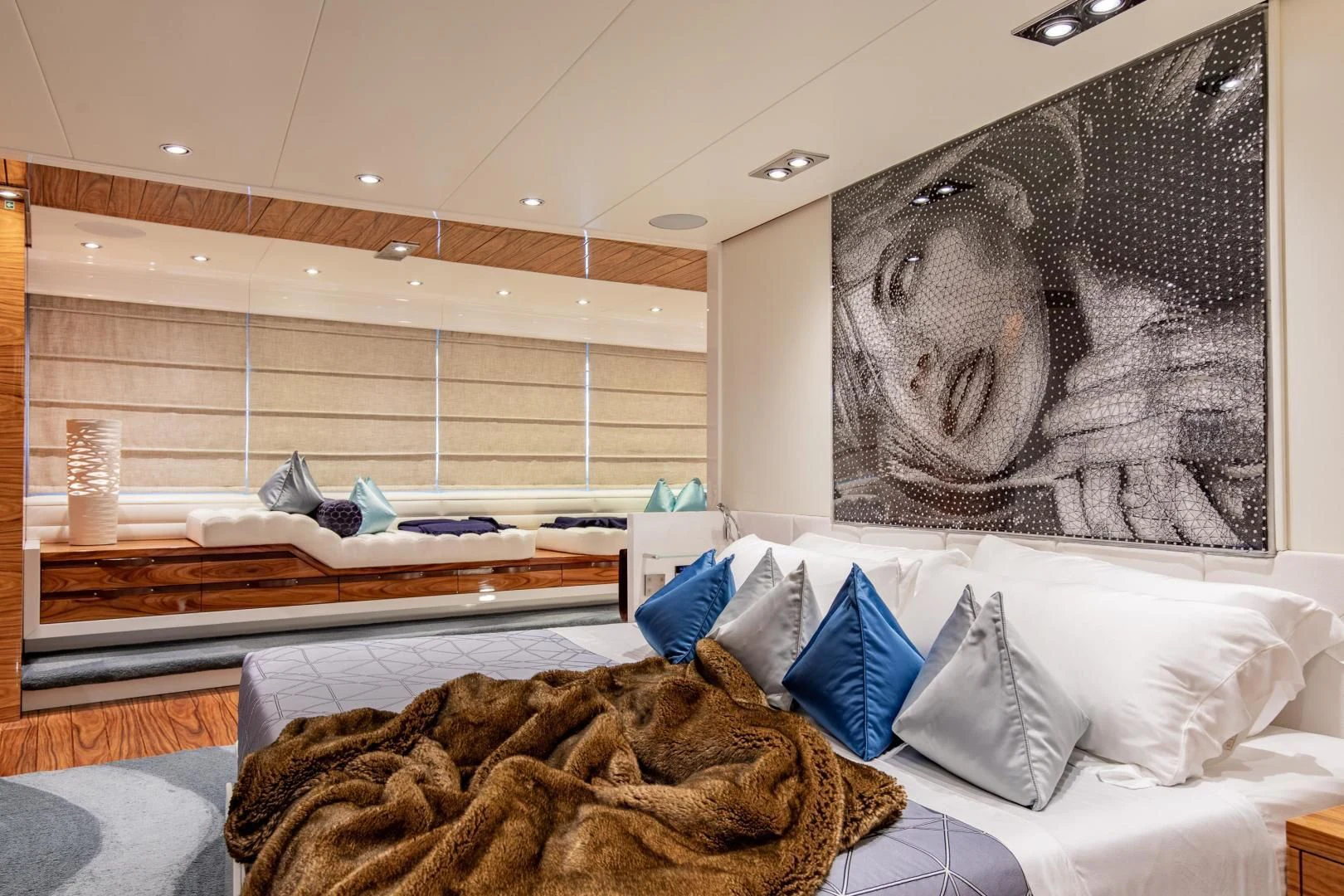 a room with a bed and a painting on the wall aboard HATT MILL Yacht for Sale