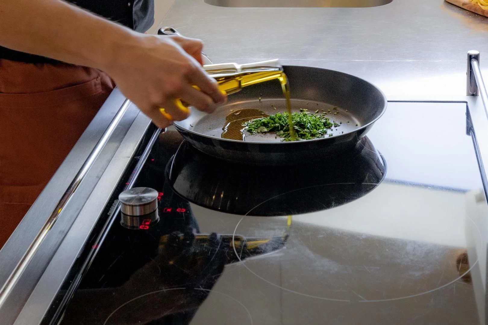 a person cooking food on a stove aboard HATT MILL Yacht for Sale
