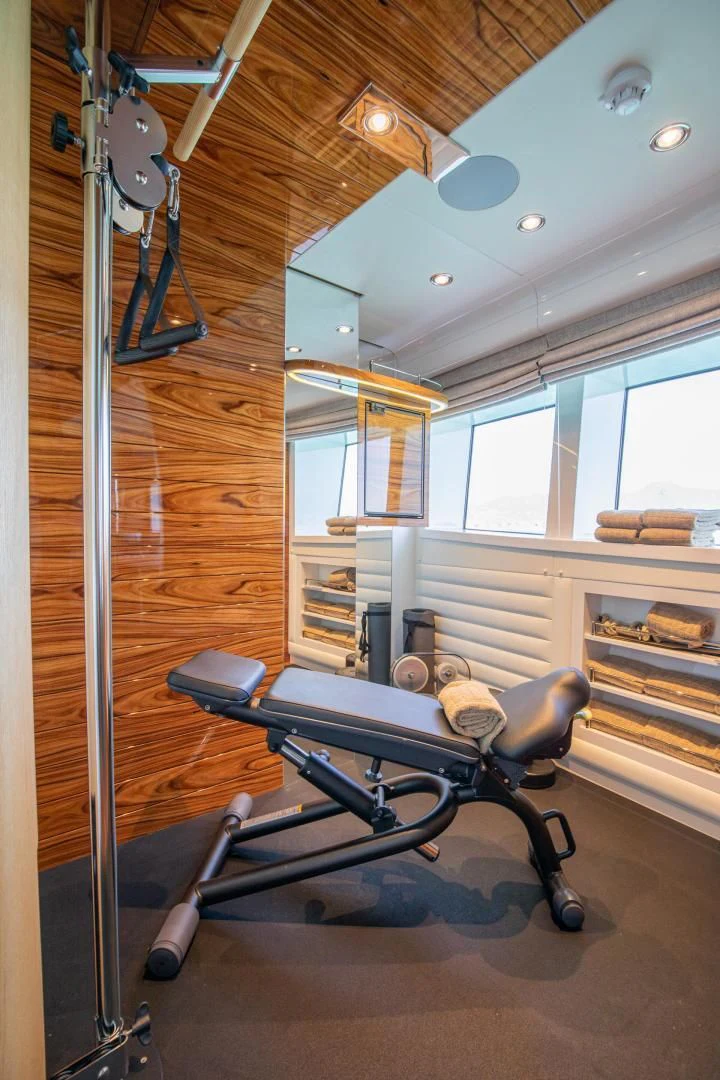 a room with a table and a wheel chair aboard HATT MILL Yacht for Sale