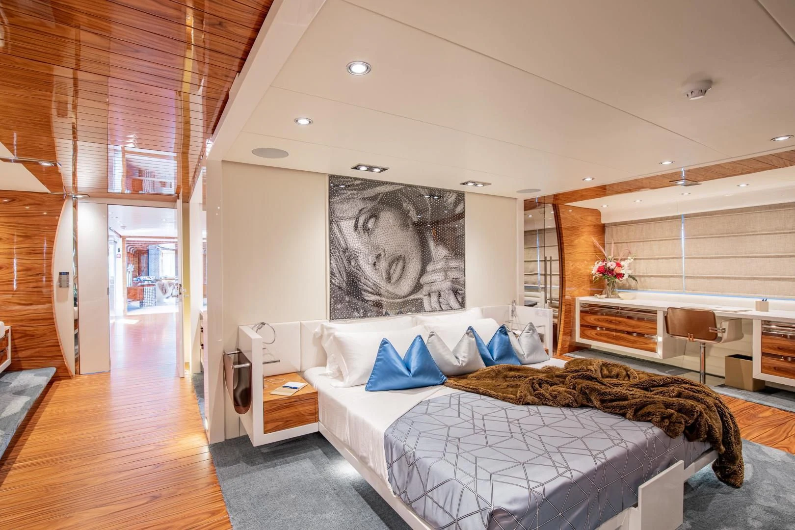 a bedroom with a bed and a desk aboard HATT MILL Yacht for Sale