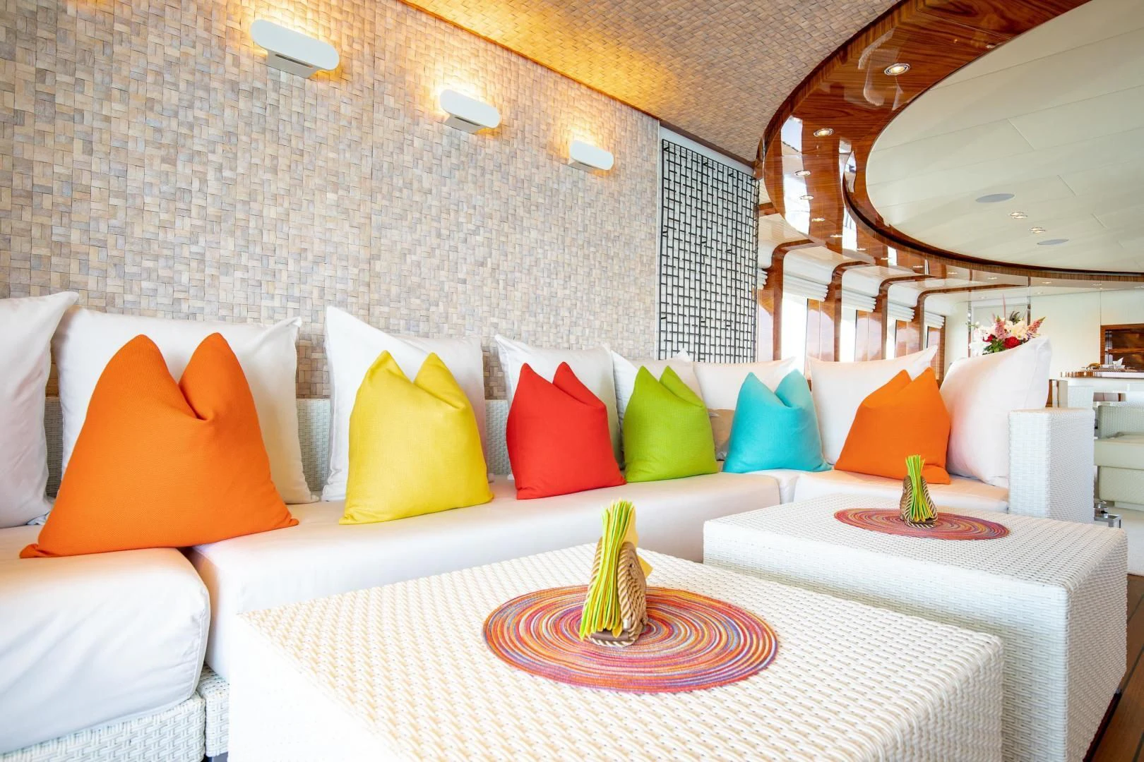 a bed with white sheets and colorful pillows aboard HATT MILL Yacht for Sale