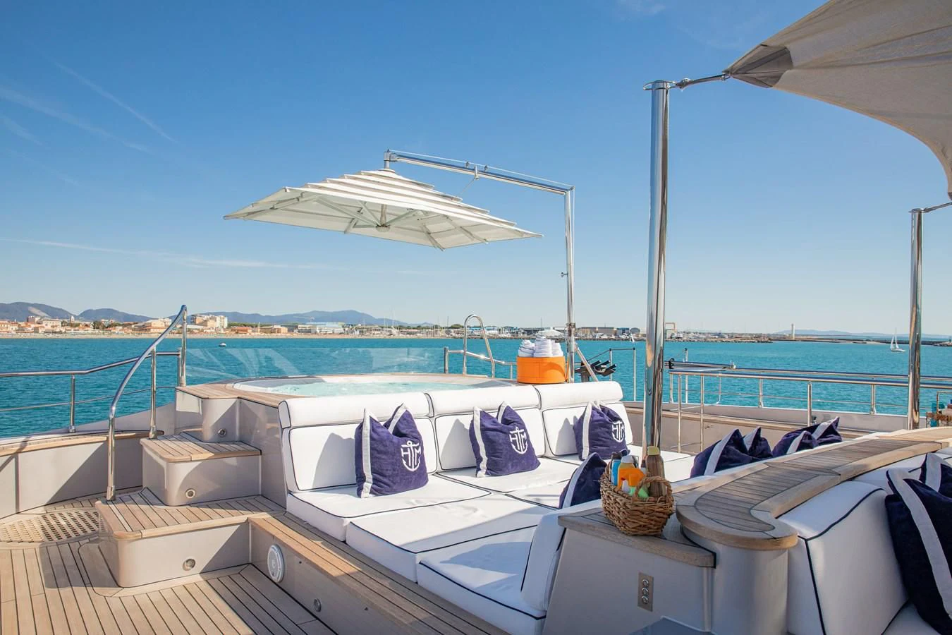 a boat with a basket and a umbrella on it aboard HATT MILL Yacht for Sale