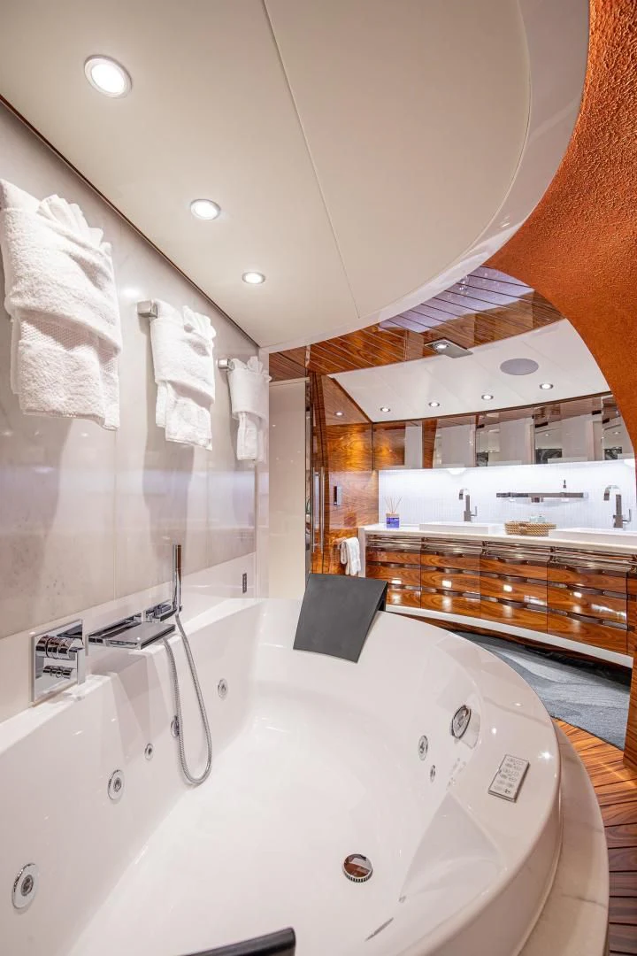 a bathroom with a bathtub and a sink aboard HATT MILL Yacht for Sale