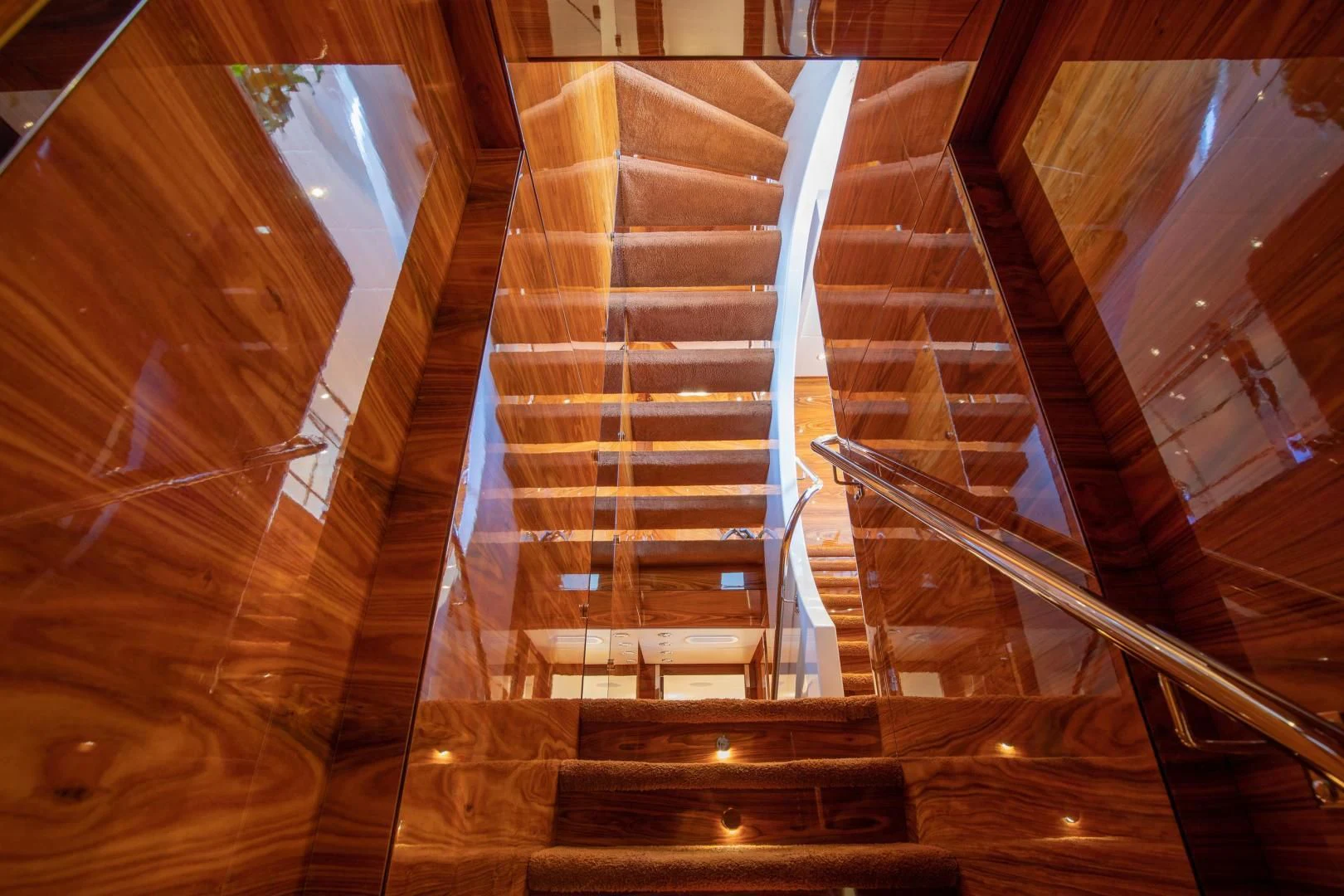 a staircase with a glass window aboard HATT MILL Yacht for Sale
