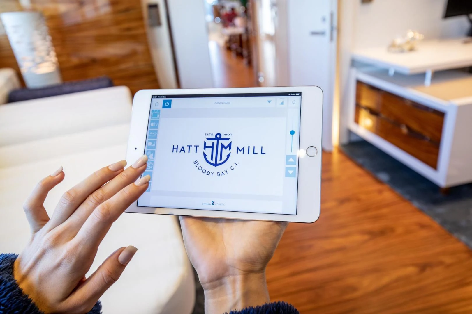 a person holding a tablet aboard HATT MILL Yacht for Sale