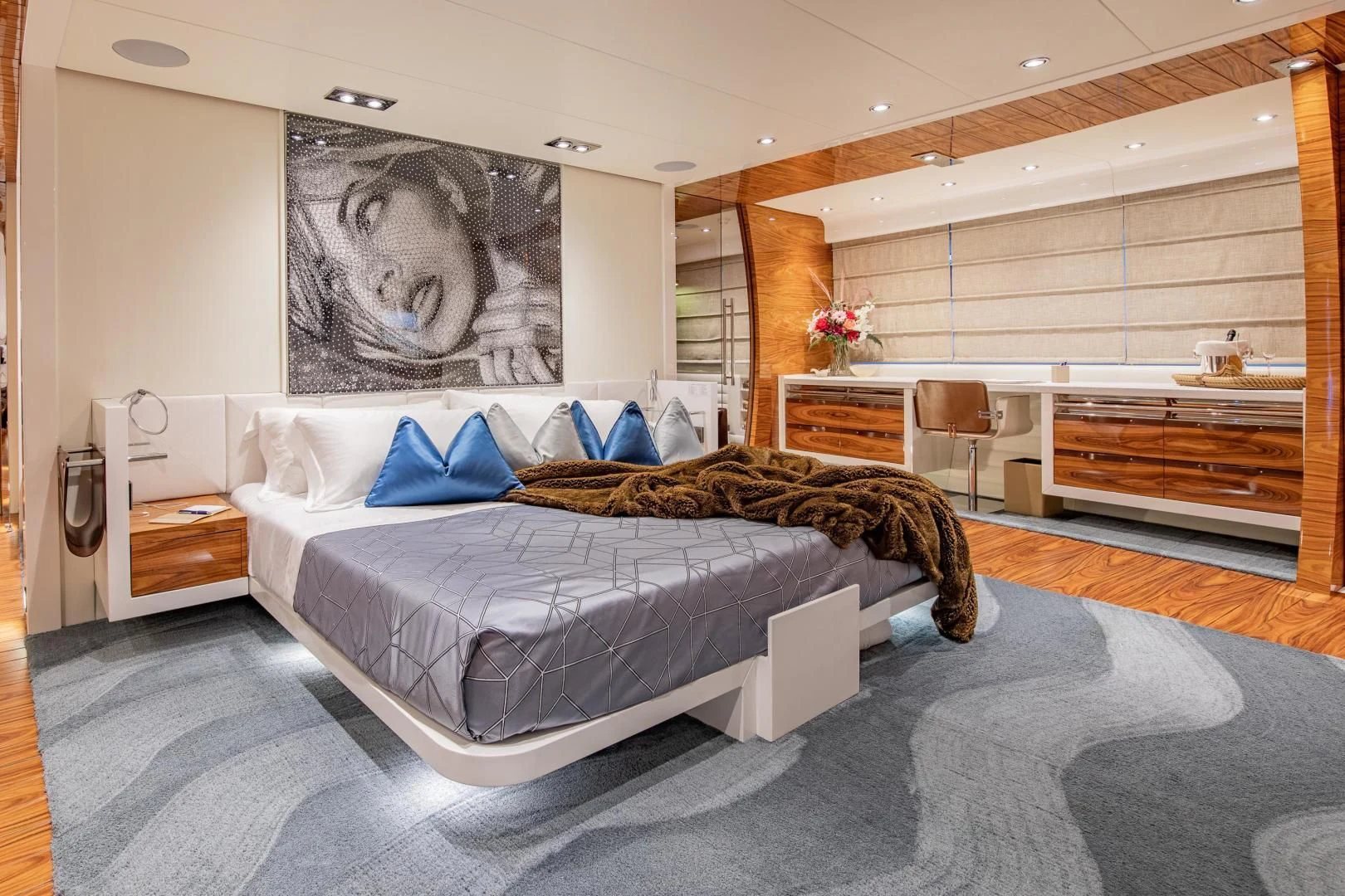 a bedroom with a bed and a desk aboard HATT MILL Yacht for Sale