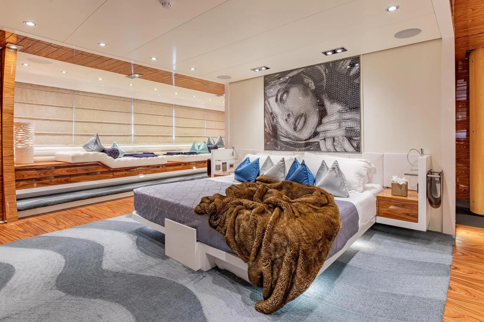a large cat lying on a bed aboard HATT MILL Yacht for Sale