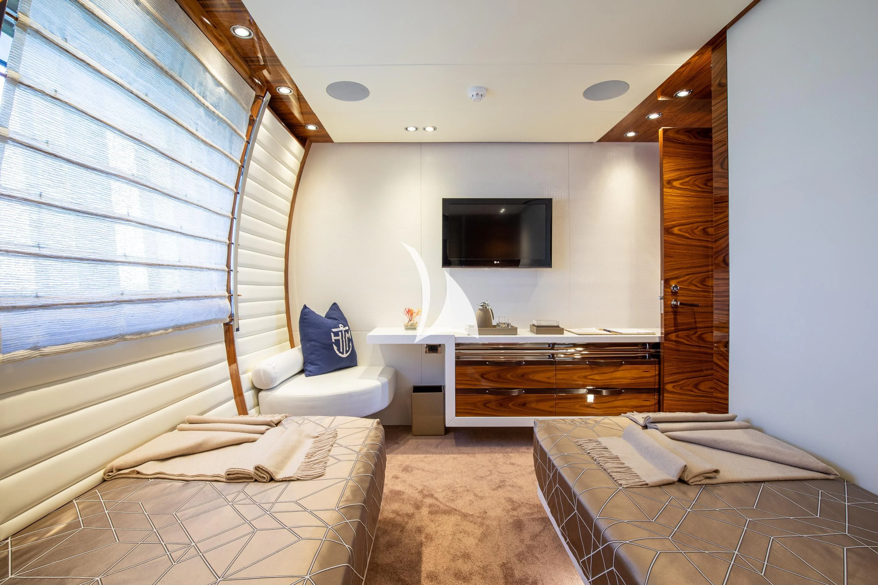 a bedroom with a tv and a bed aboard HATT MILL Yacht for Sale