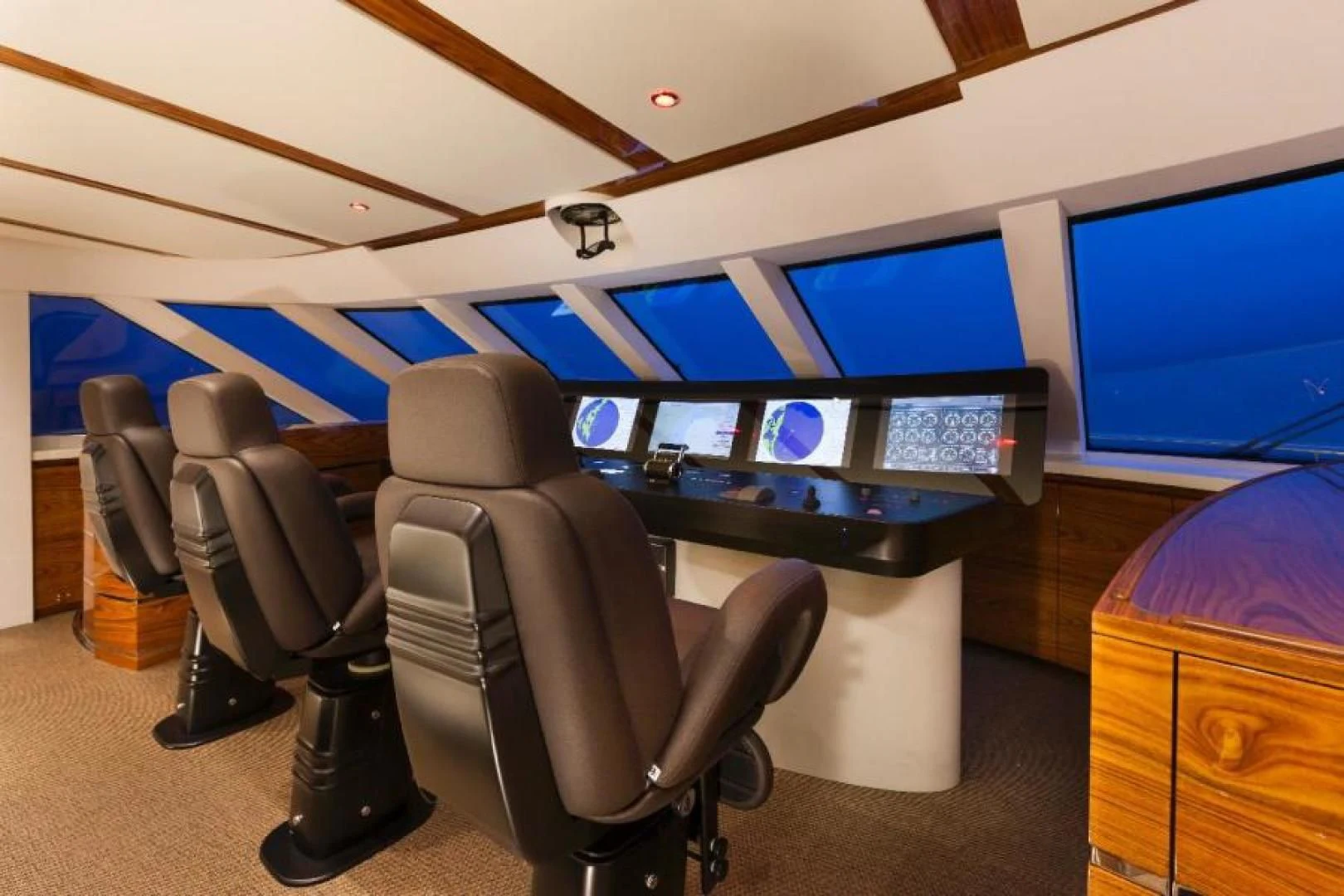 a room with chairs and desks aboard HATT MILL Yacht for Sale