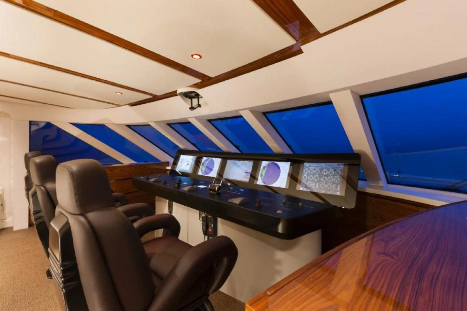 a room with a desk and chairs aboard HATT MILL Yacht for Sale