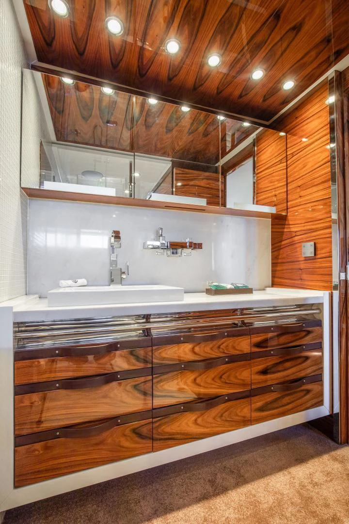 a bathroom with a large mirror aboard HATT MILL Yacht for Sale
