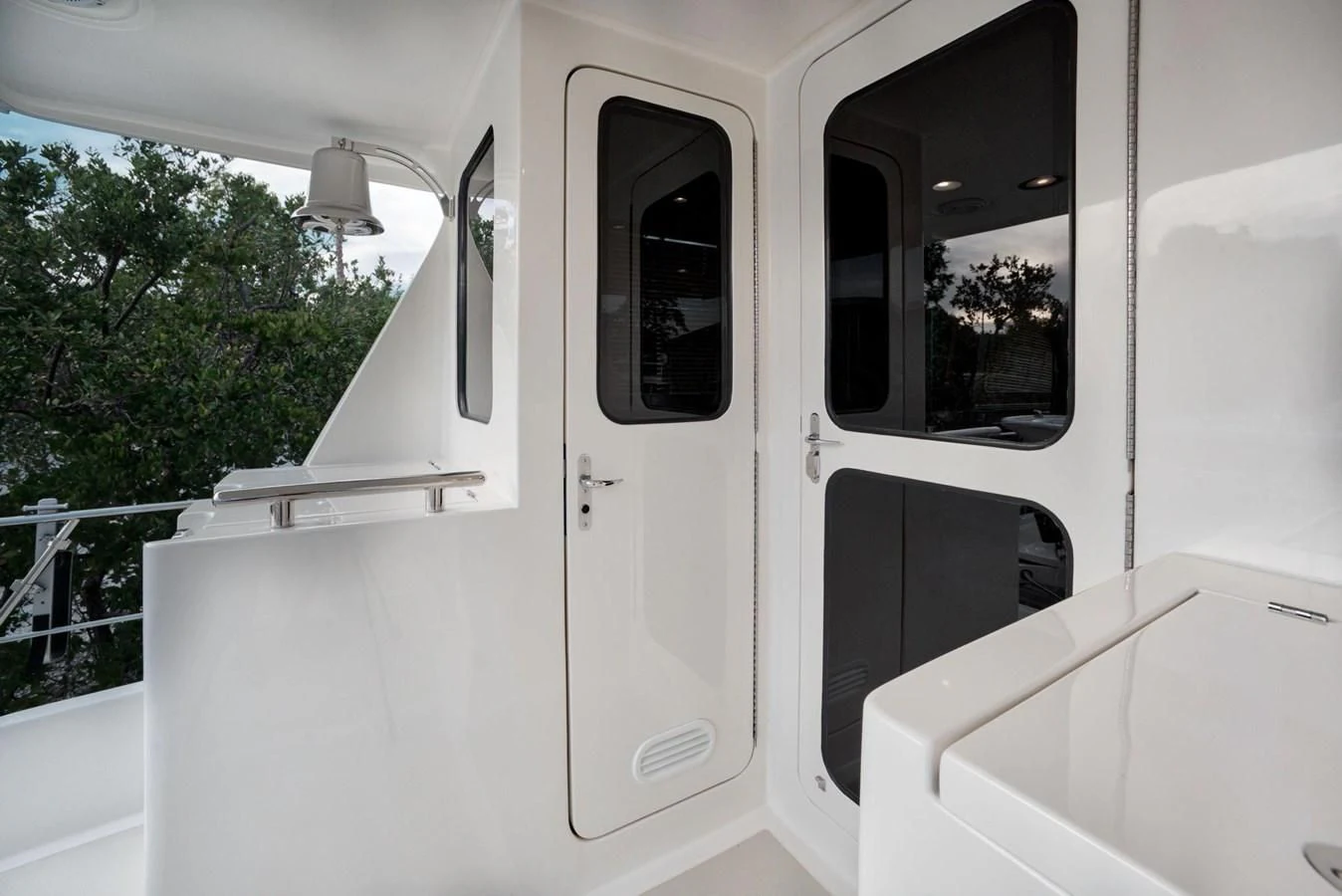 a white car with a door open aboard BEN'S BARGE Yacht for Sale