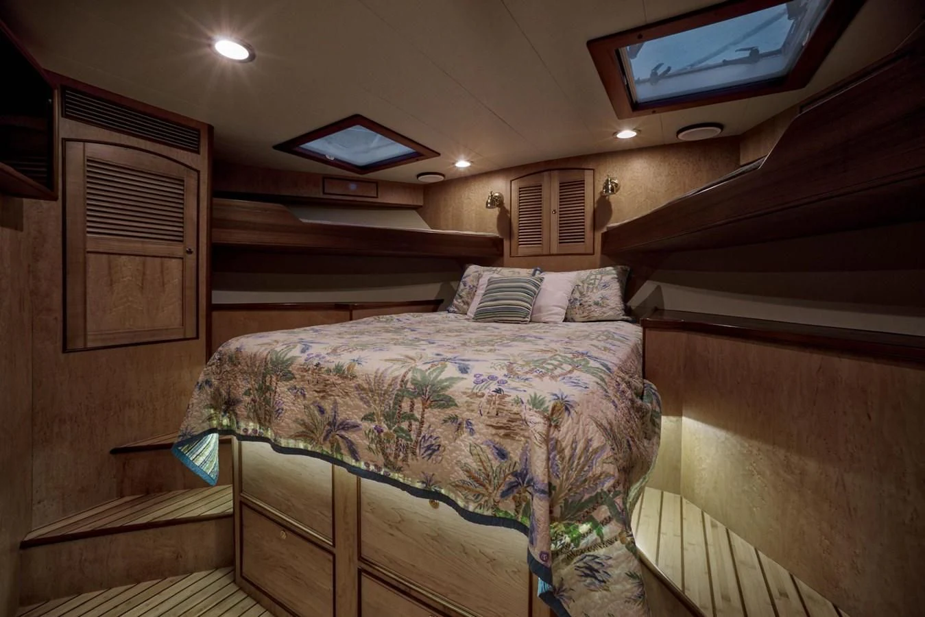 a room with a bed and a television on the wall aboard BEN'S BARGE Yacht for Sale