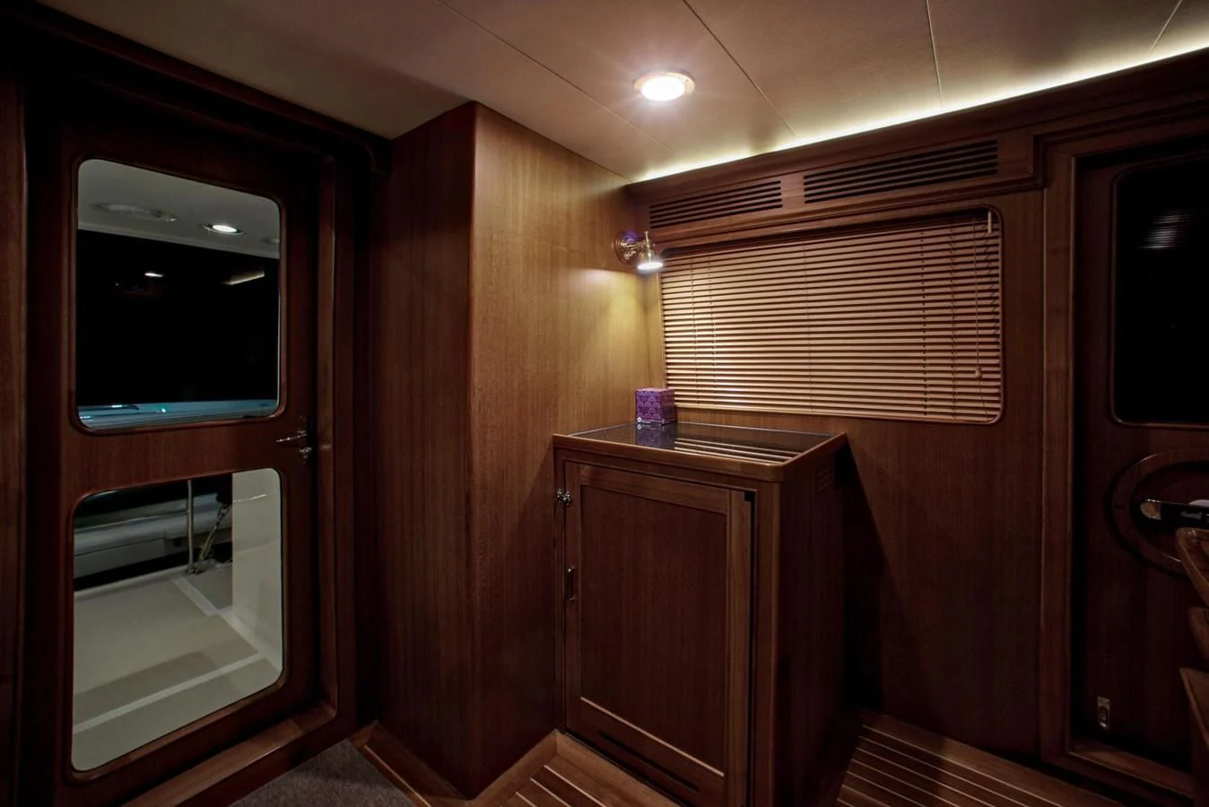 a room with wooden walls and a wood cabinet and a window aboard BEN'S BARGE Yacht for Sale