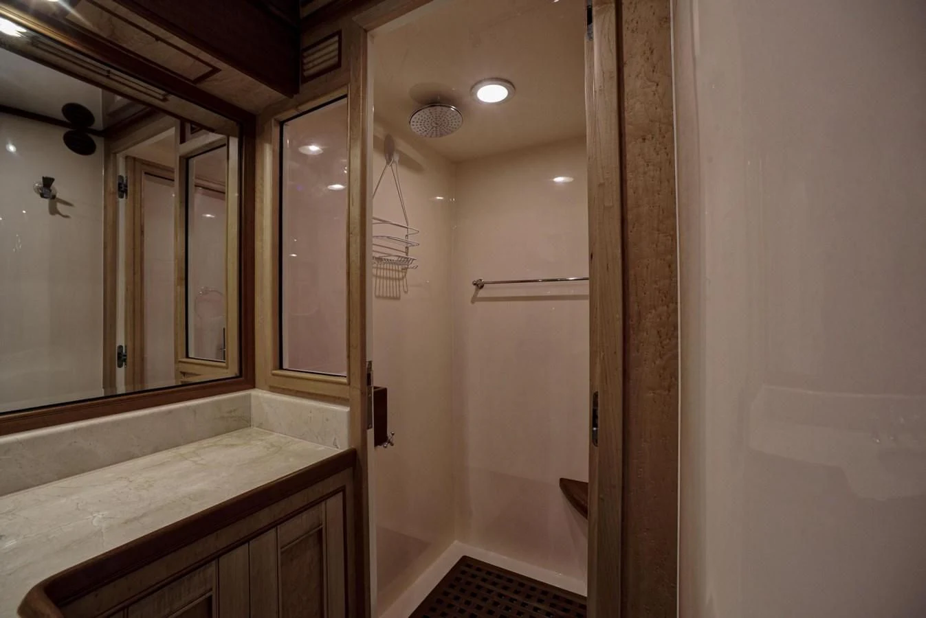 a bathroom with a large mirror aboard BEN'S BARGE Yacht for Sale