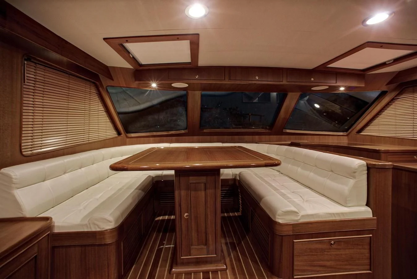 a room with a bed and a table aboard BEN'S BARGE Yacht for Sale