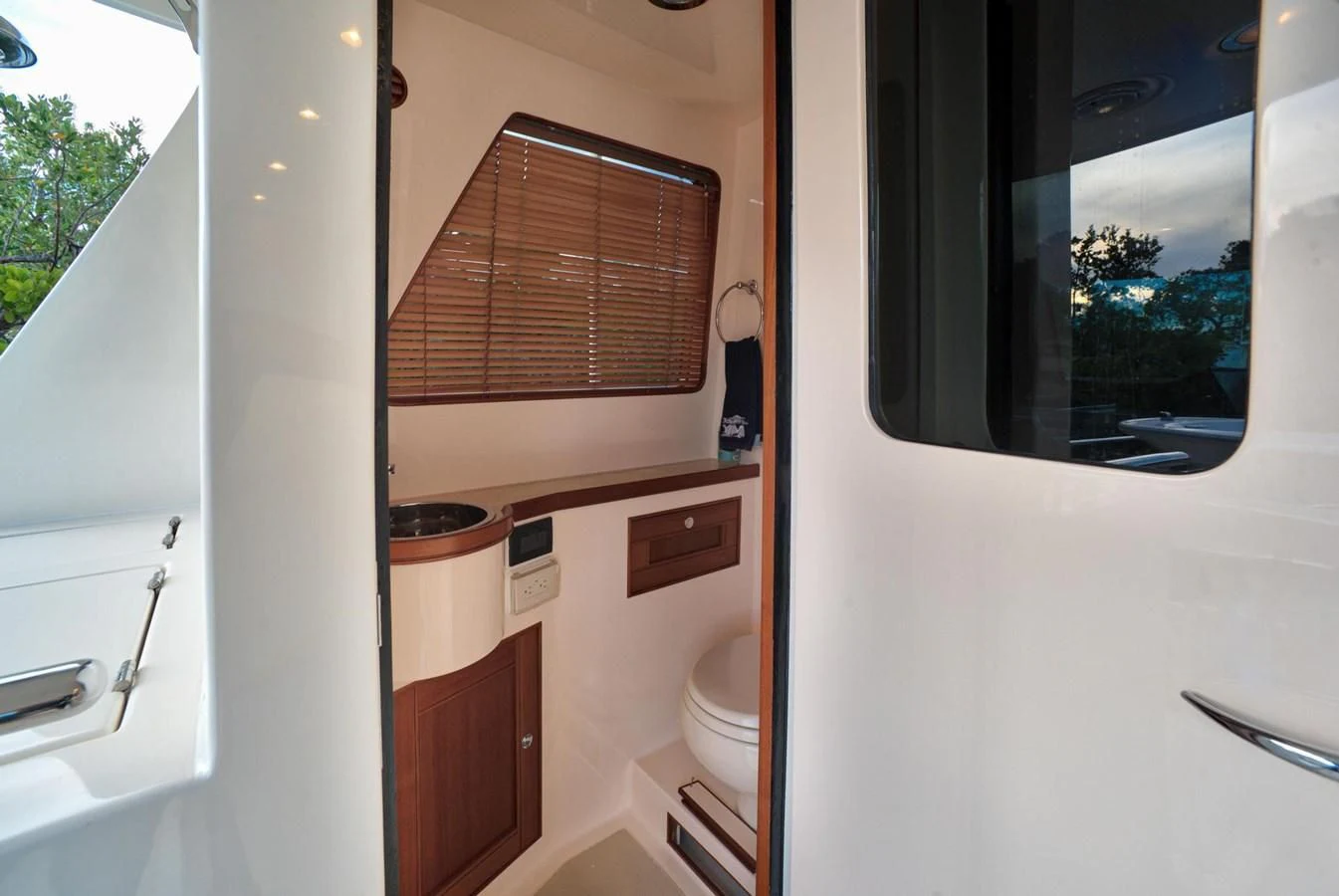 a bathroom with a toilet and a sink aboard BEN'S BARGE Yacht for Sale