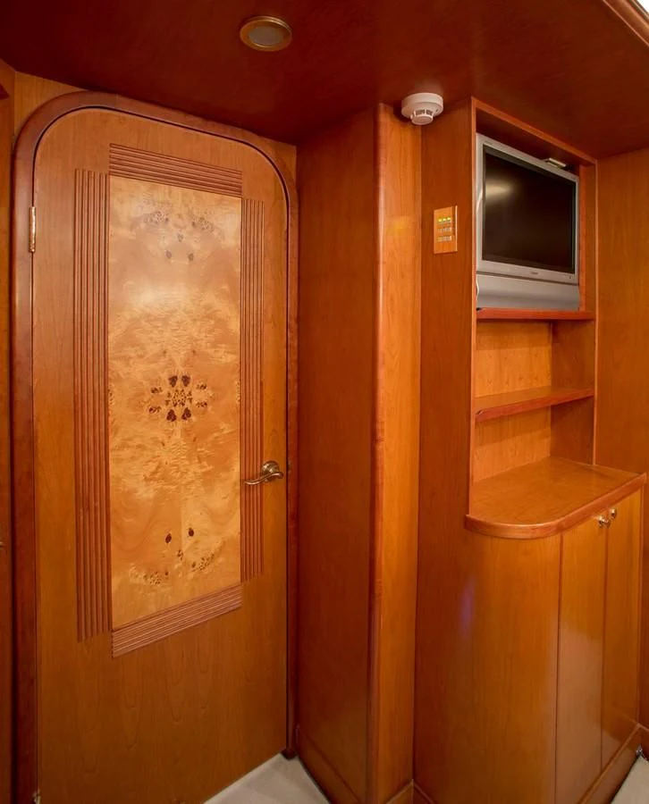 a wooden cabinet with a window aboard SILVER WINGS Yacht for Sale