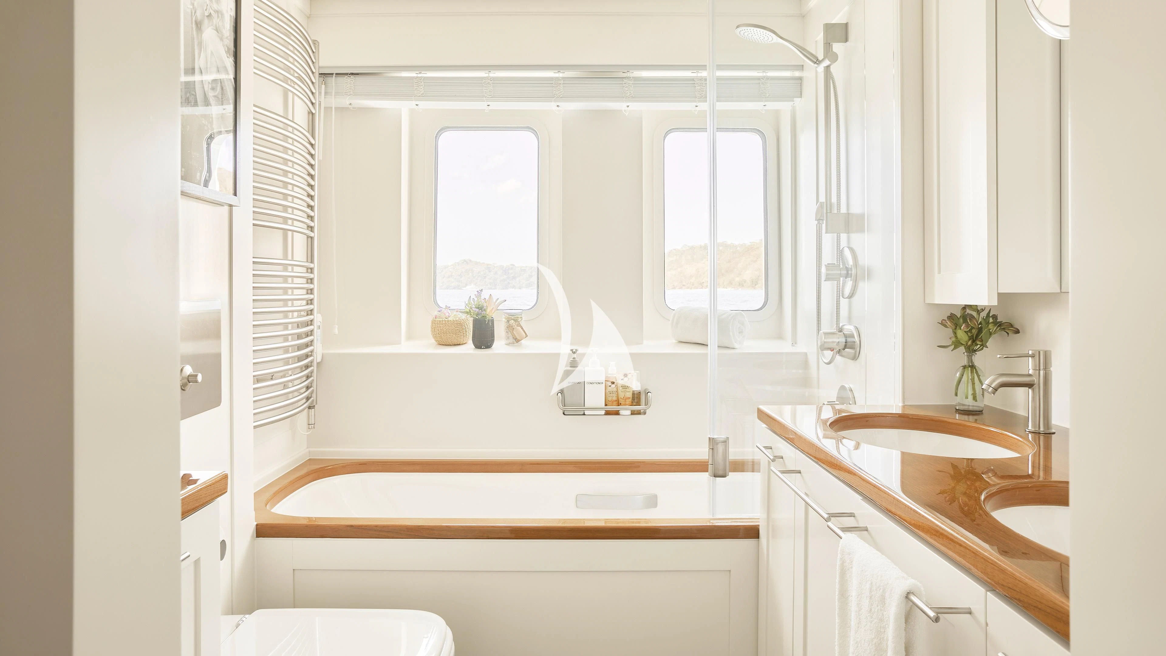 a bathroom with a sink and a mirror aboard SENSES Yacht for Sale