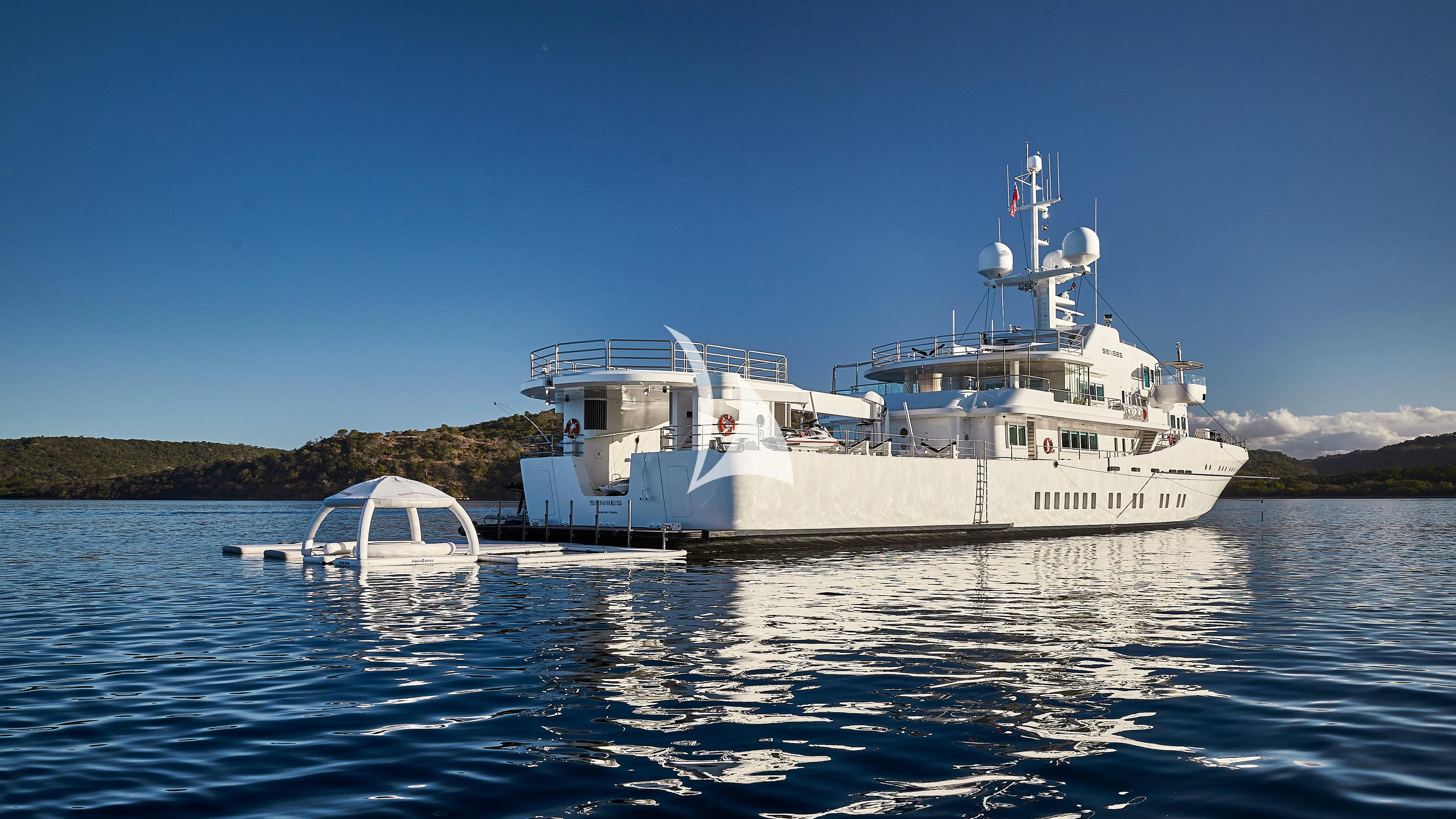 a large white boat on the water aboard SENSES Yacht for Sale