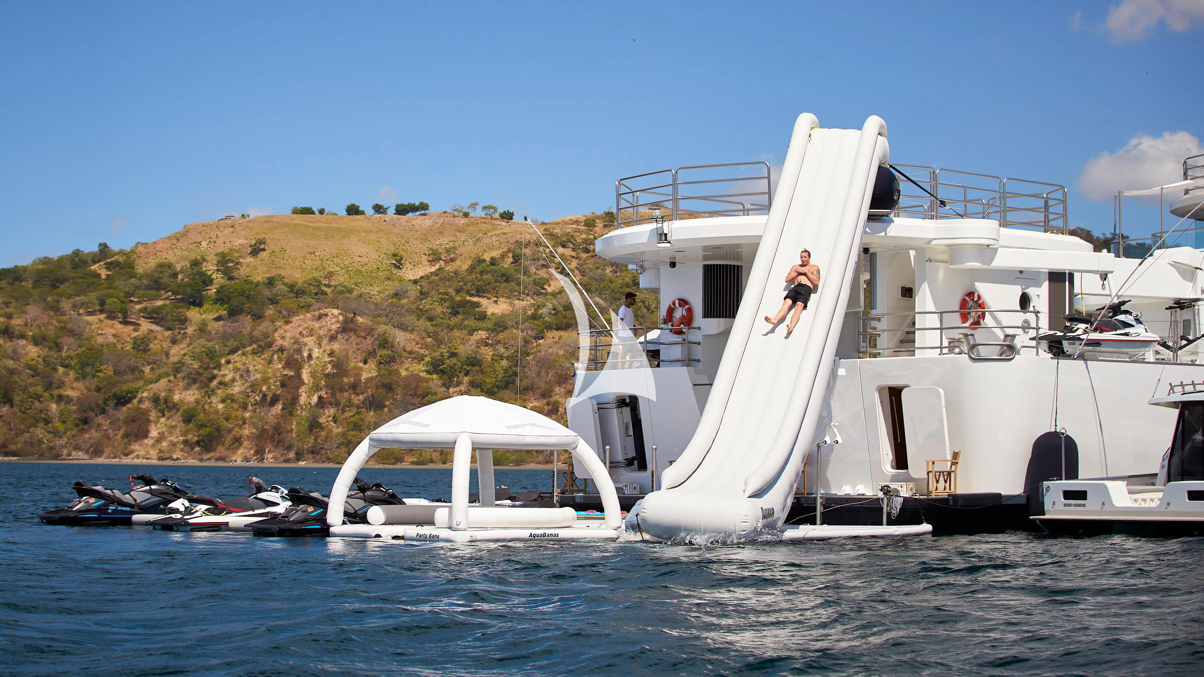 a couple of people on a boat aboard SENSES Yacht for Sale