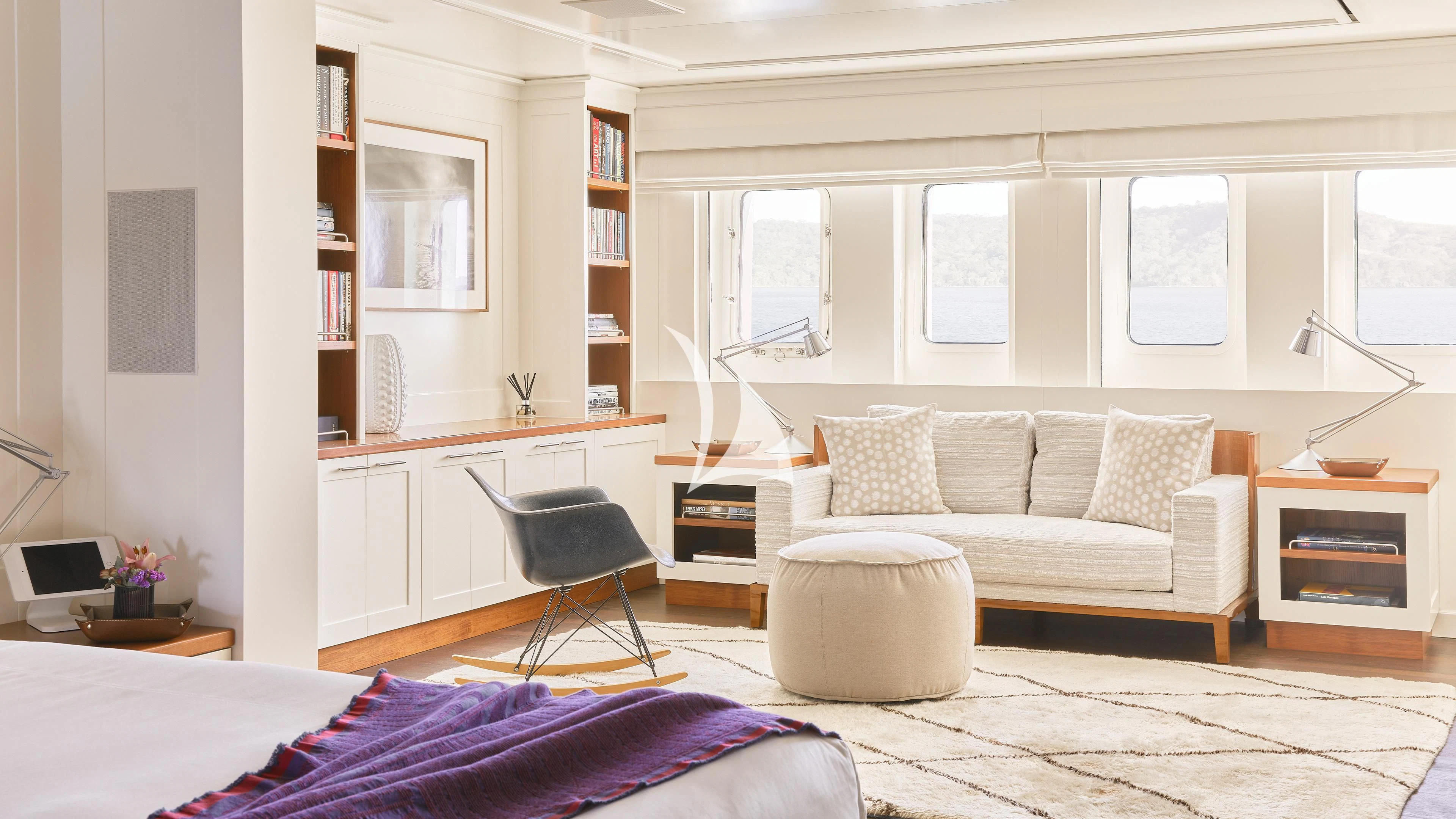 a living room with a couch and a desk aboard SENSES Yacht for Sale