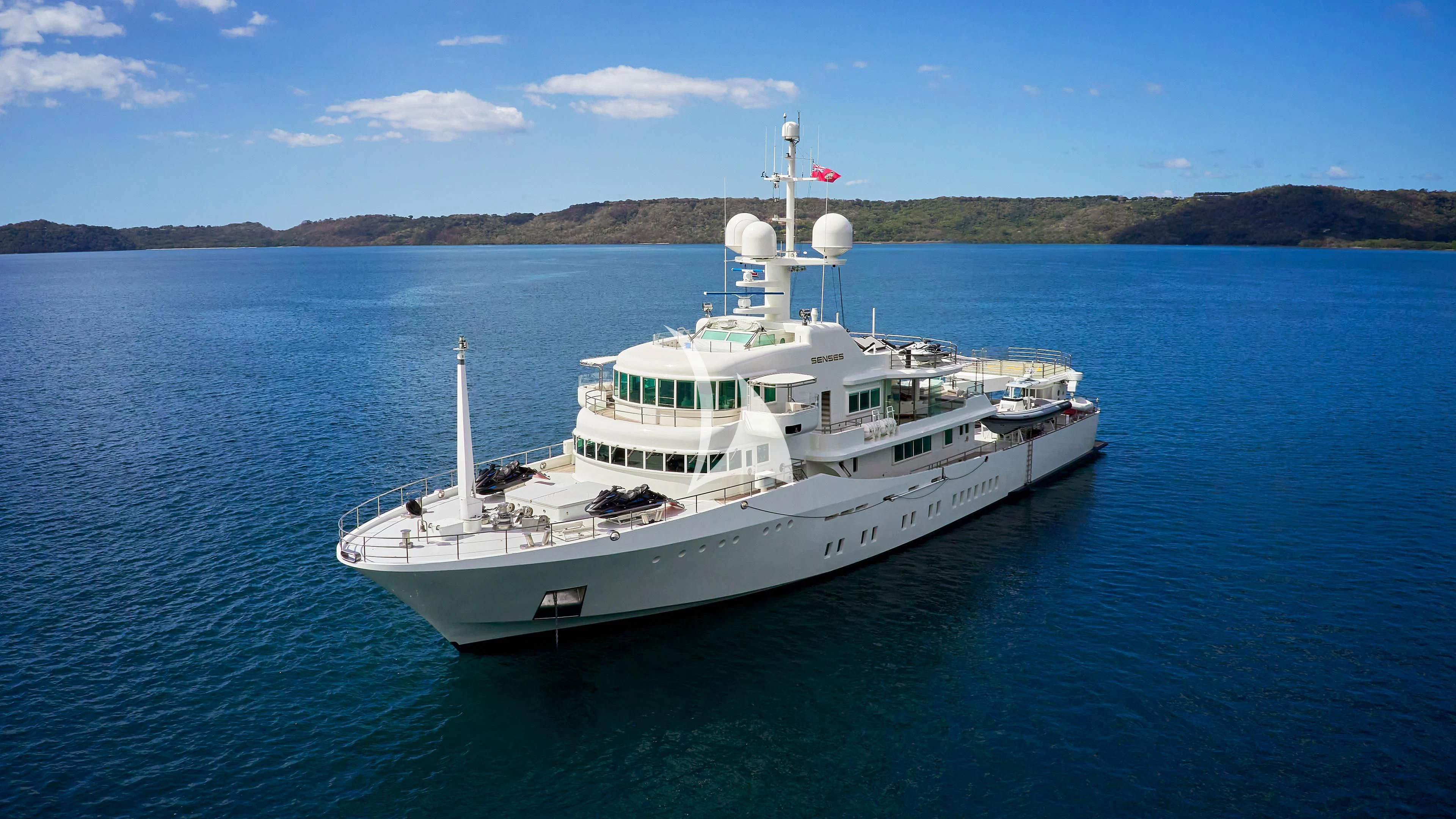 a large white ship in the water aboard SENSES Yacht for Sale