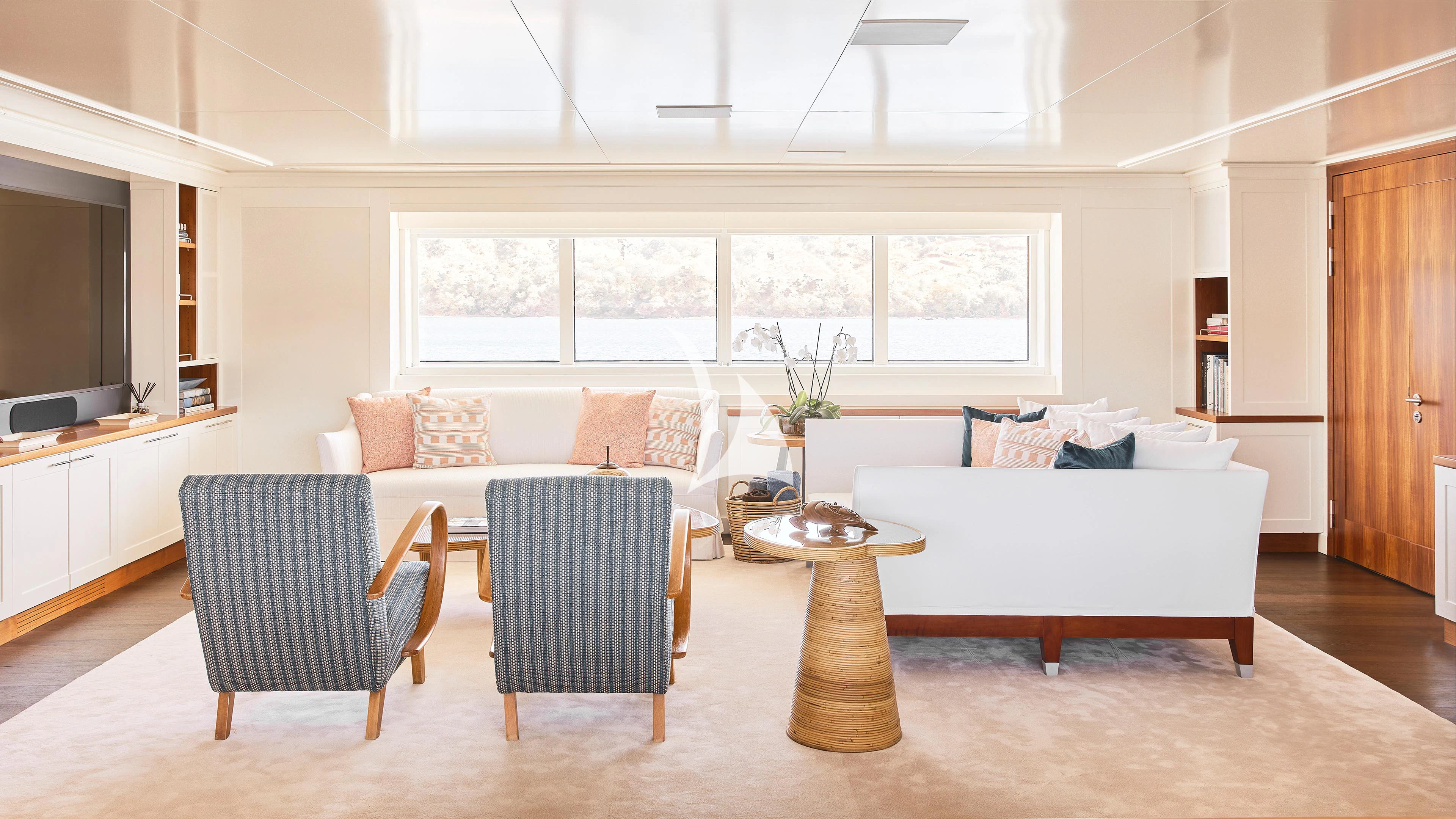 a living room with a couch and a table aboard SENSES Yacht for Sale